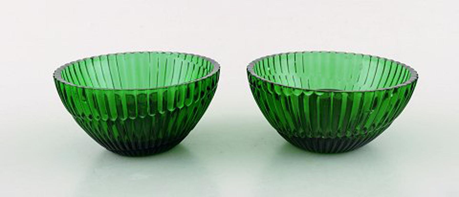 Arthur Percy for Nybro Sweden. Collection of green art glass. 9 pieces, 2 pairs of candlesticks, creamers, etc.
In perfect condition.
Measures: Large creamer: 11 x 9 cm.
Sticker.