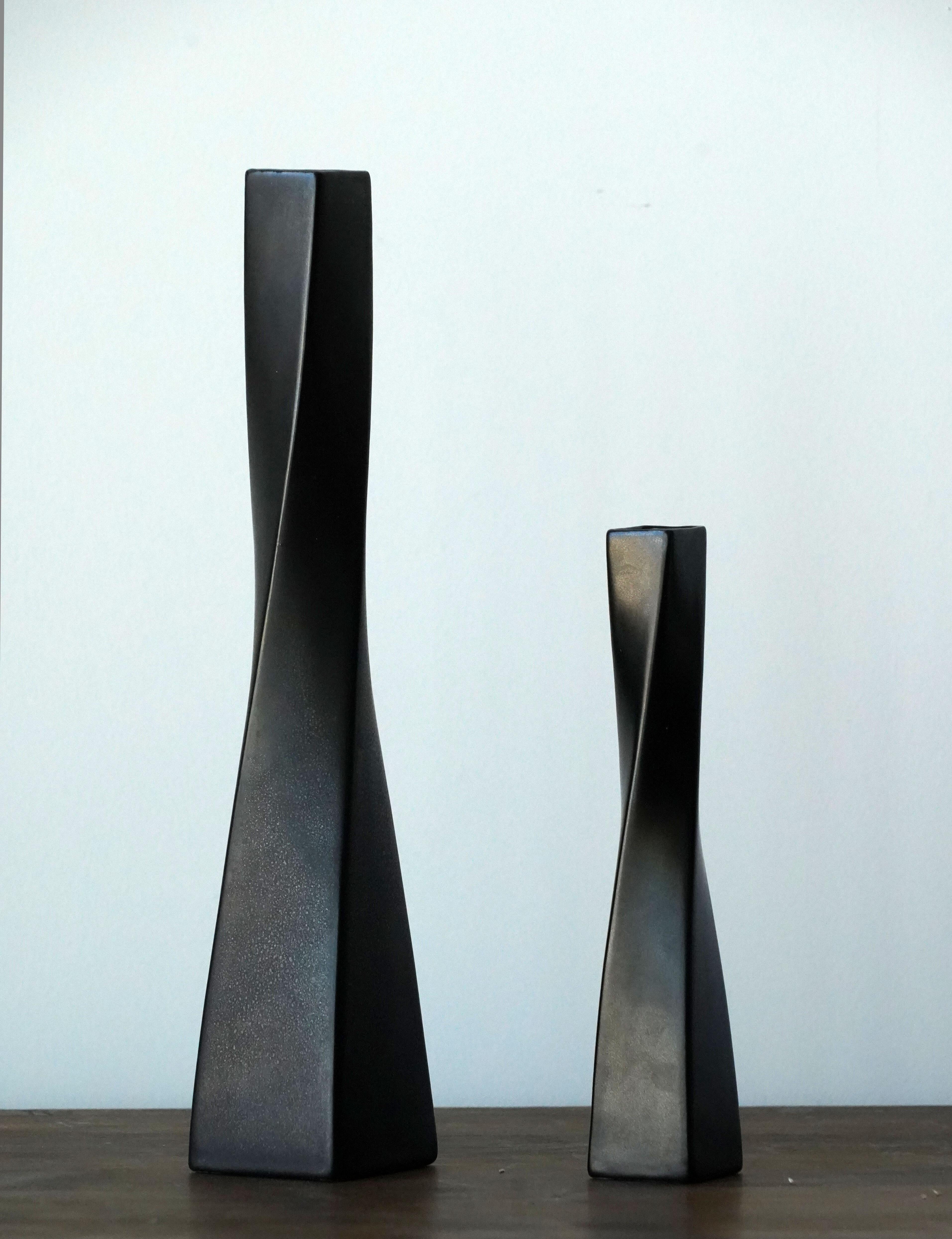 A set of two stoneware vases designed by Arthur Percy for Upsala Ekeby Gefle, Sweden. Bears the matte-black 