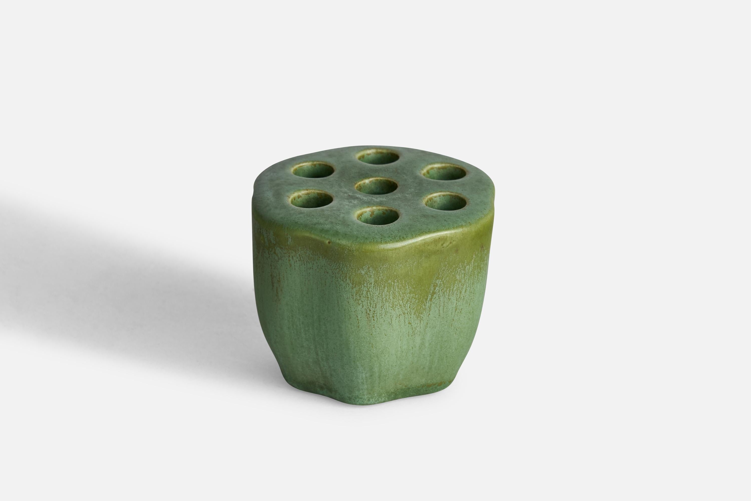 A green-glazed ceramic pen holder designed by Arthur Percy and produced by Gefle, Sweden, c. 1930s.