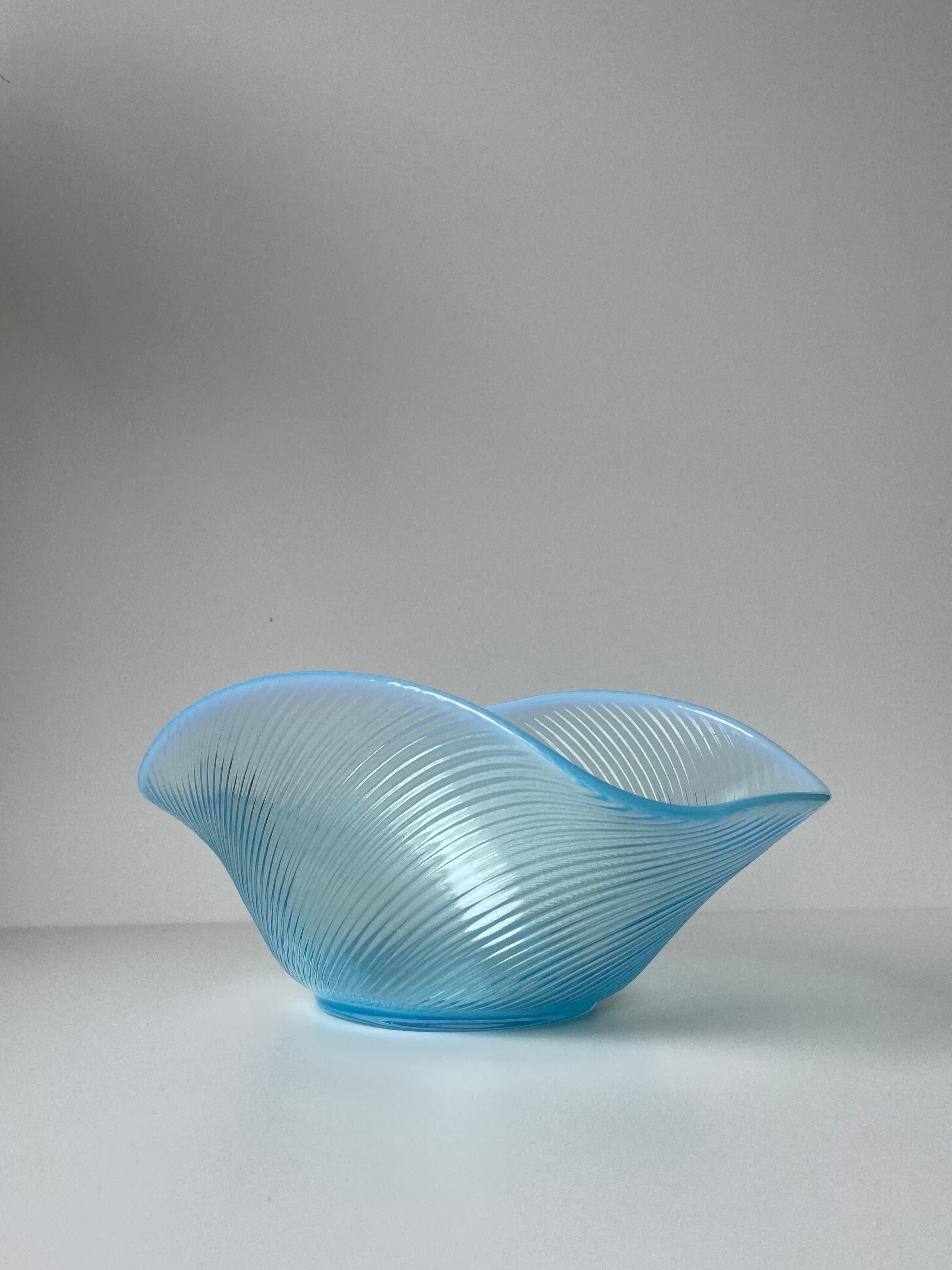 Large and delicate sky blue tinted Swedish midcentury modern textured glass bowl from the Reffla series (reffla is Swedish for grooves) designed by Arthur Percy in 1952. White and light blue opalescent glass constitutes this graceful vessel with