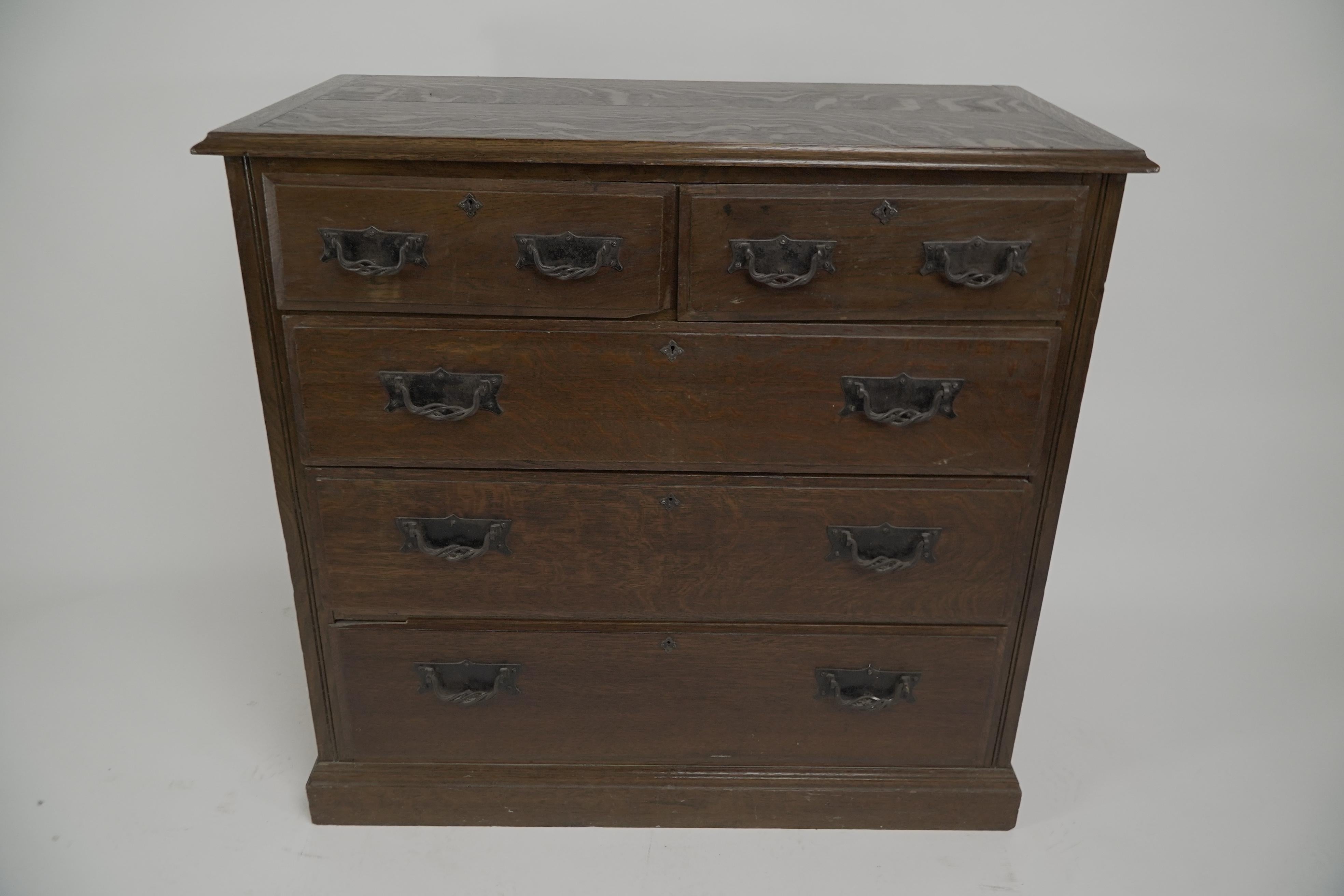 Arthur Simpson of Kendal. An Arts and Crafts oak chest of drawers with hand-formed writhen iron handles and made from beautiful hand chosen quarter sawn wild grain oak.
