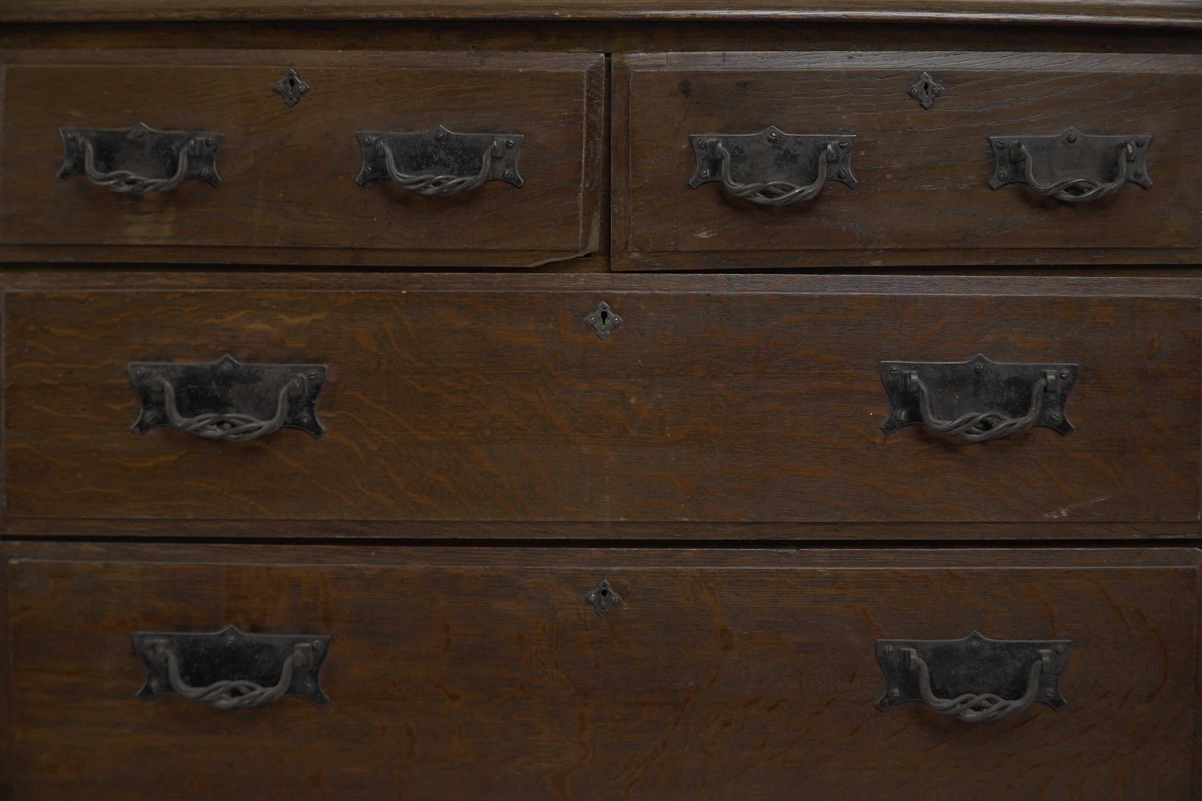 Oak Arthur Simpson of Kendal. Arts & Crafts oak chests of drawers with iron handles. For Sale