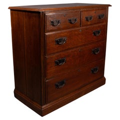Arthur Simpson of Kendal. Arts & Crafts oak chests of drawers with iron handles.