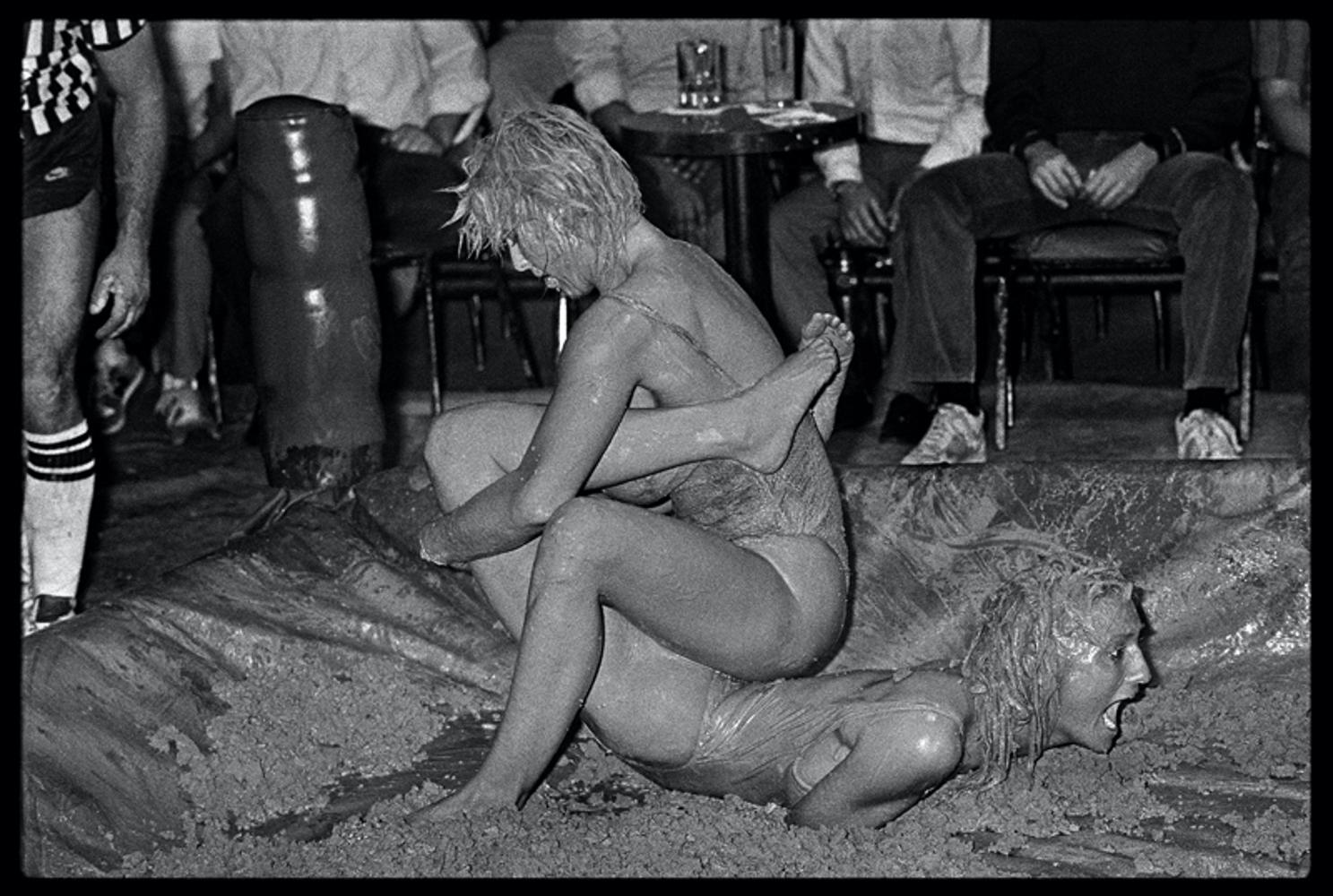 Catfight III
by Arthur Steel

Catfight – Female Bikini Mud Wrestlers, Hollywood Tropicana, Los Angeles 1985 – Set of 6 prints.

Arthur recalls:
“I was in Los Angeles with the British cricketer Ian Botham, as he was hoping to forge a career as a