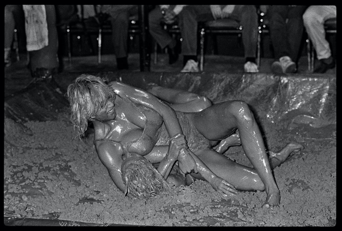 Catfight IV 
by Arthur Steel

Catfight – Female Bikini Mud Wrestlers, Hollywood Tropicana, Los Angeles 1985 – Set of 6 prints.

Arthur recalls:
“I was in Los Angeles with the British cricketer Ian Botham, as he was hoping to forge a career as a