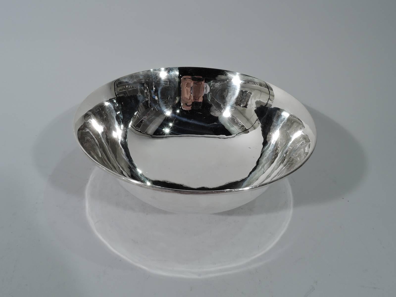 Handmade sterling silver bowl. Made by Arthur Stone in Gardner, mass. Curved and tapering sides and stepped foot. A beautiful piece in the craftsman tradition. Hallmark includes bench man’s initial G for Herman W. Glendenning, who was active from