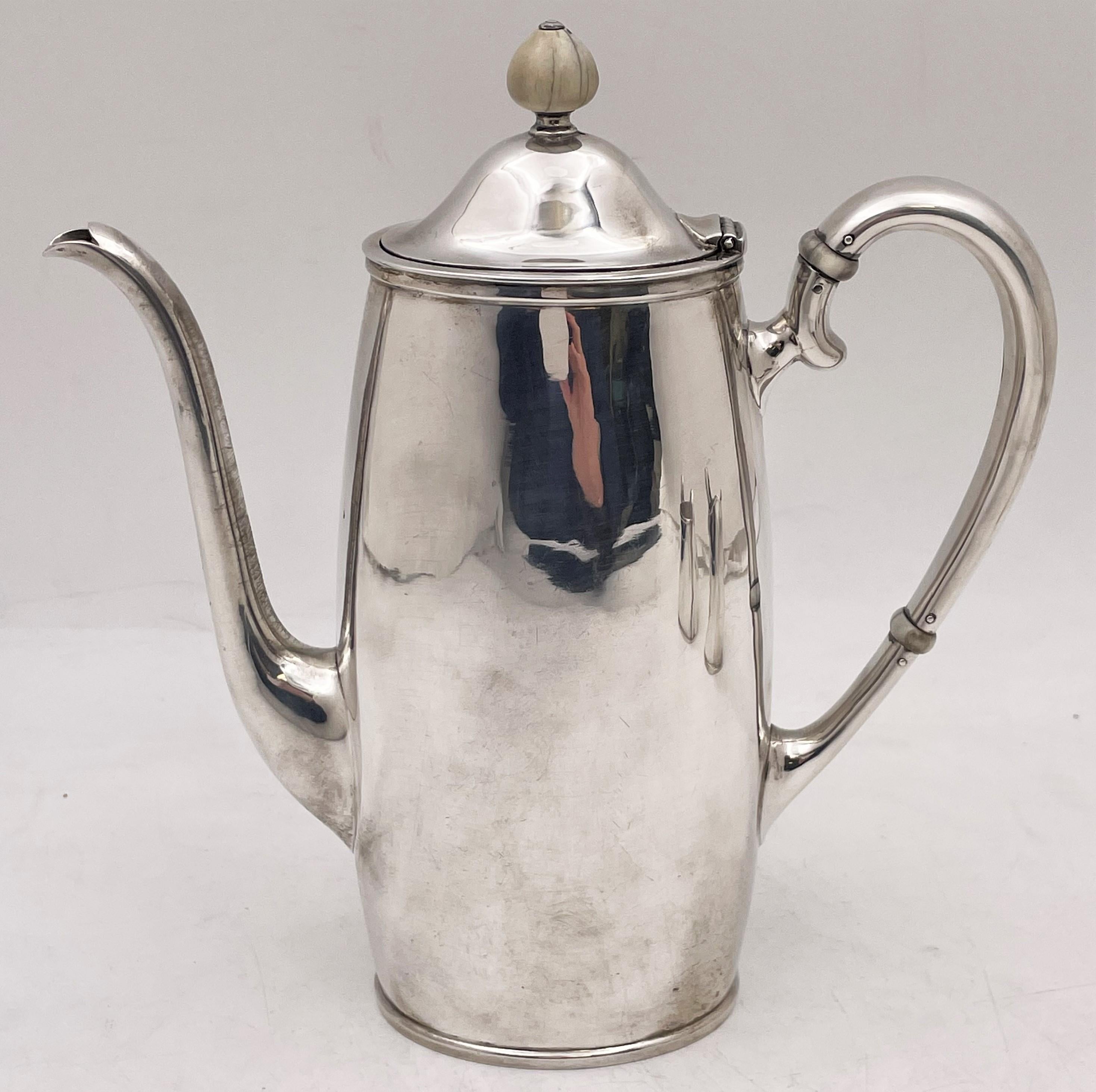Arthur Stone, hand hammered sterling silver 3-piece demitasse set in Arts & Crafts style from the early 20th century. This elegant set exhibits the attention to geometric, curvilinear design typical of the Arts & Crafts movement, and consists