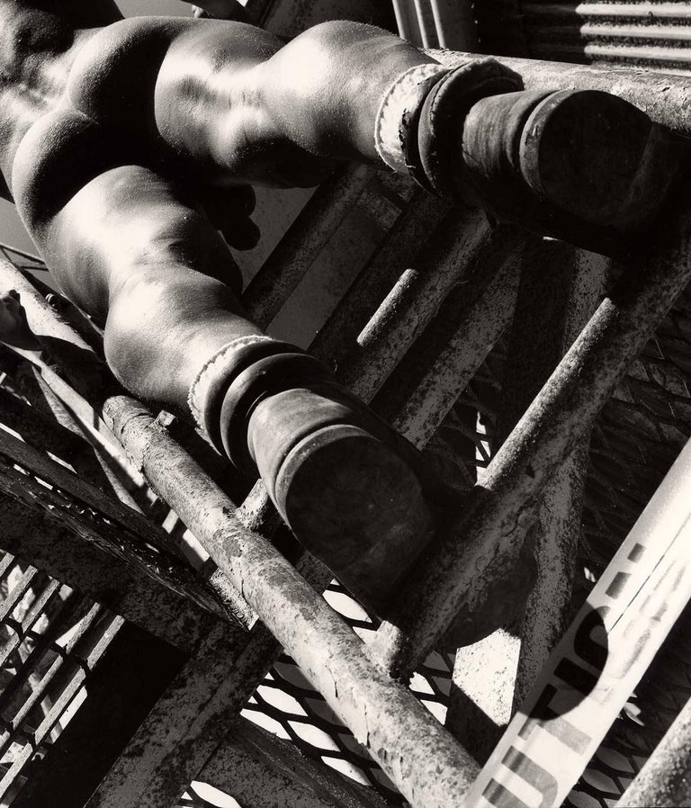 Arthur Tress - Caution: Man at Work (Nude construction worker clad only in boots climbs ladder