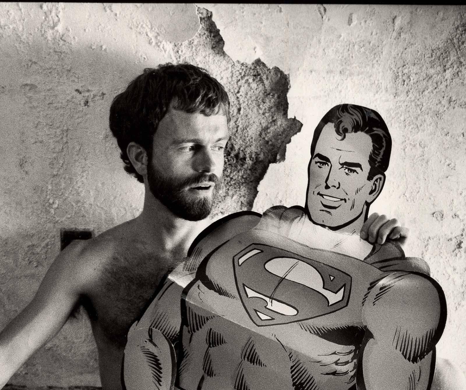 Superman Fantasy, New York (Male Nude fills the gap in super hero cutout figure) - Photograph by Arthur Tress