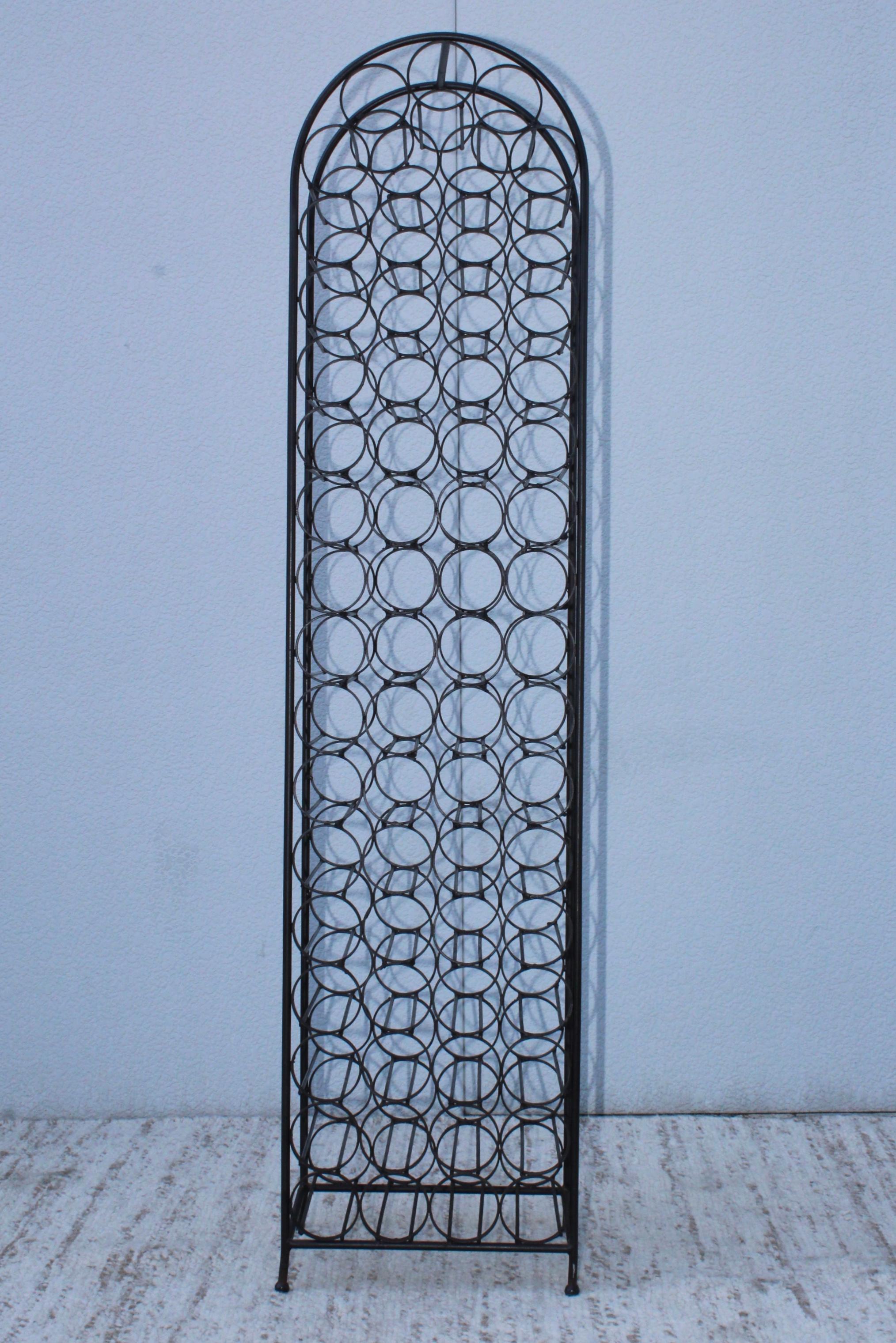 1960s Arthur Umanoff designed wrought iron 67-bottle wine rack.