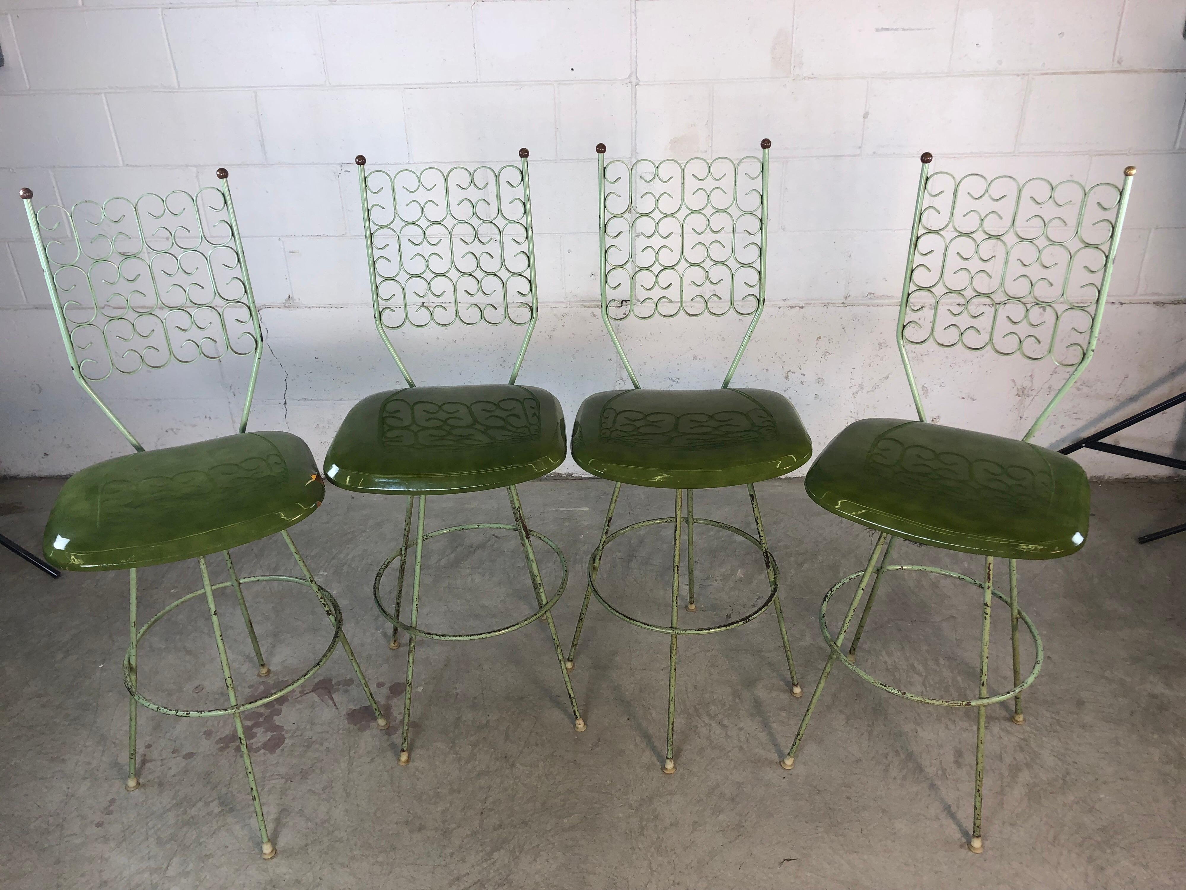 Vintage Mid-Century Modern set of four bar stools designed by Arthur Umanoff for the Boyeur Scott Furniture Co., Granada collection. The stools are in the original condition and have not been restored. They retain some of the original green paint.