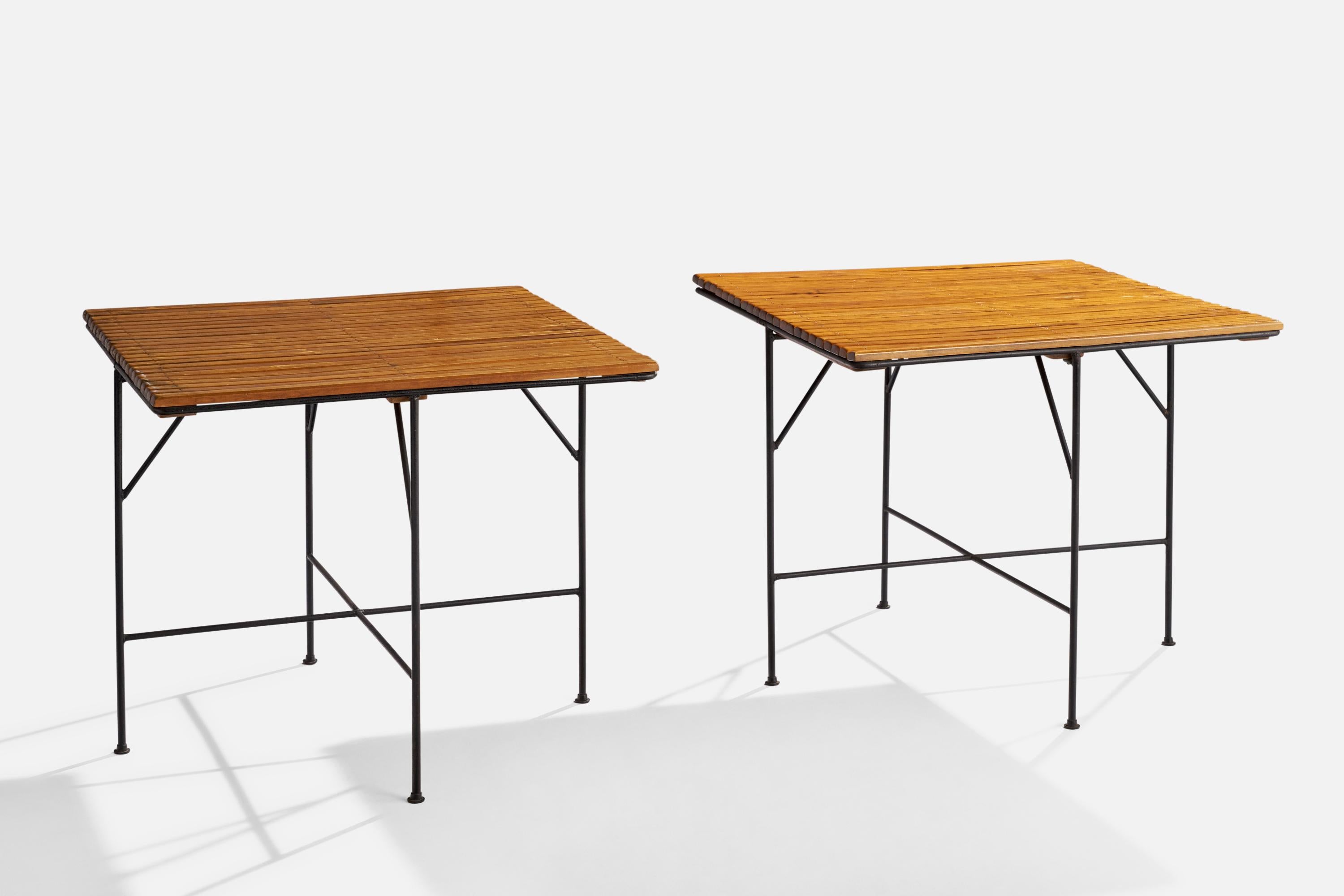 A pair of black-painted iron and wood dinette tables designed by Arthur Umanoff and produced by Raymor, USA, 1950s.