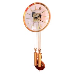 Arthur Umanoff pour Howard Miller Horloge murale en laiton et Lucite