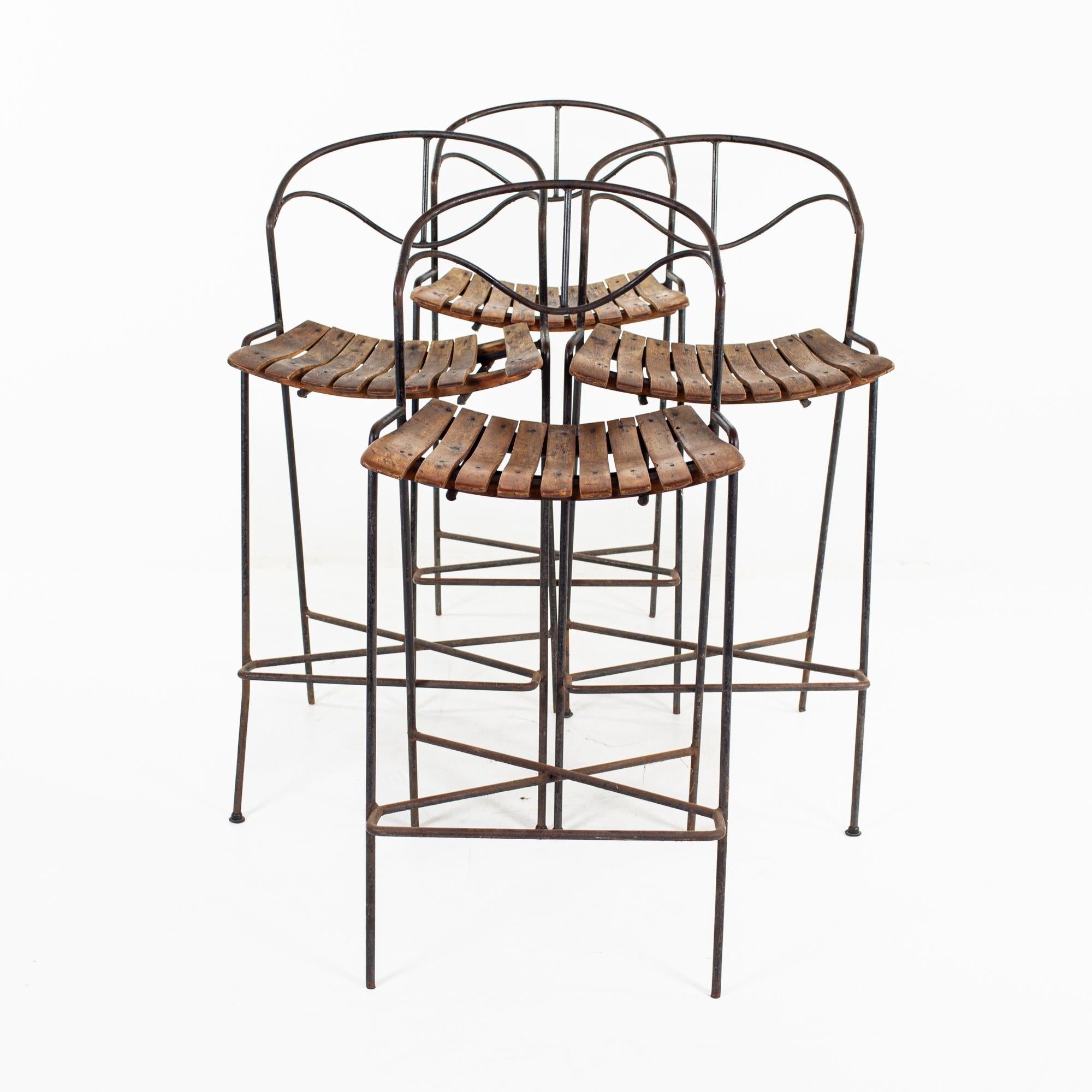 Arthur Umanoff for Raymor mid century iron and wood barstools - set of 4

This chair measure: 18 wide x 17 deep x 39 inches high, with a seat height/chair clearance of 28 inches

All pieces of furniture can be had in what we call restored