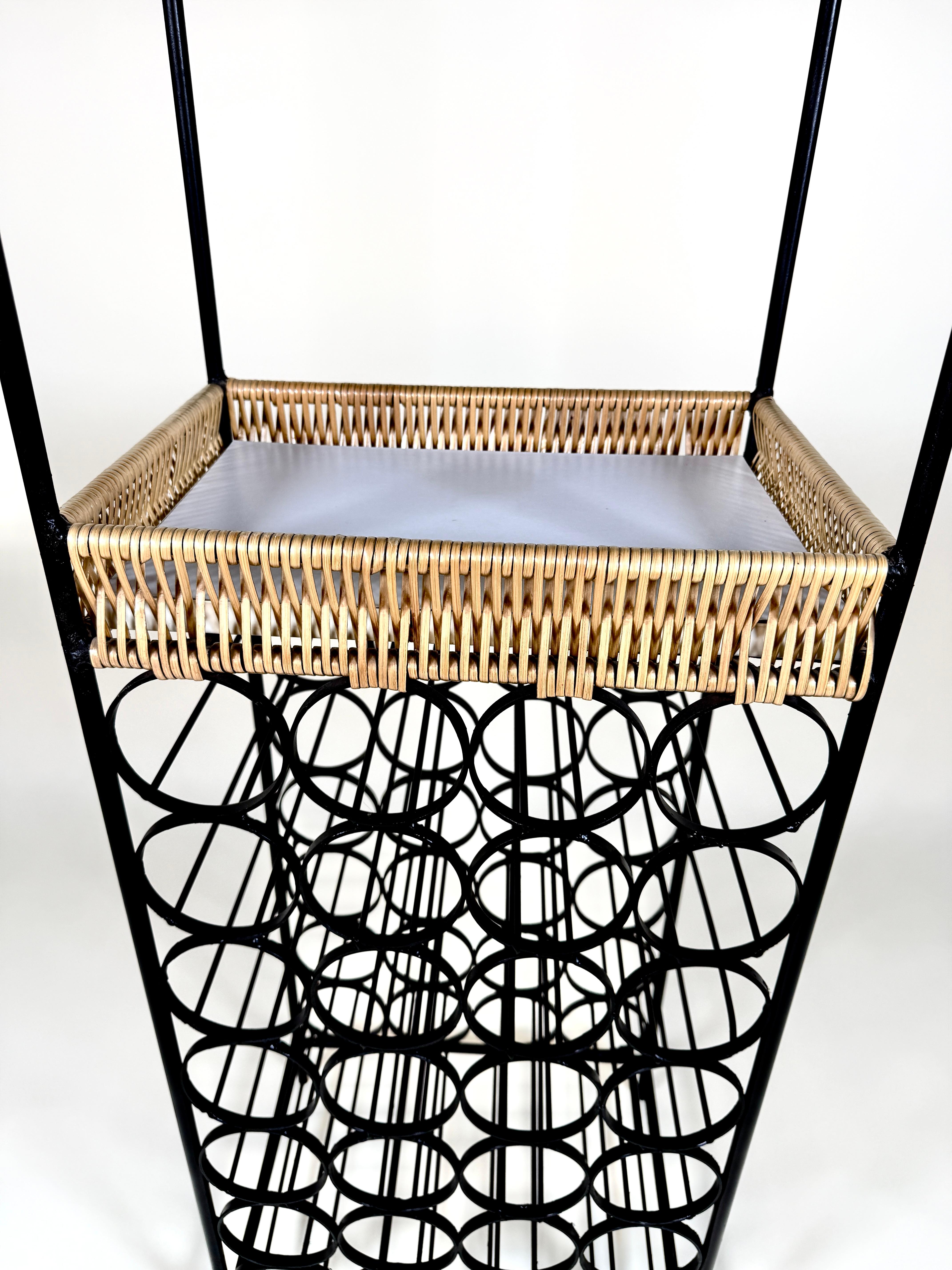 Arthur Umanoff Iron & Rattan Wine Rack with Shelves

A sculptural and highly functional piece by celebrated American designer Arthur Umanoff, this vintage wine rack showcases his signature blend of modernist form and natural materials. Crafted from