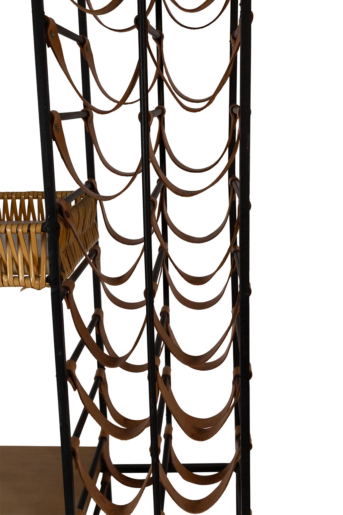 All original Arthur Umanoff wine holder/etagere circa Mid-1950s. Wonderful patina to leather and iron. Has capacity for 40 bottles of wine and 4 separate shelves.