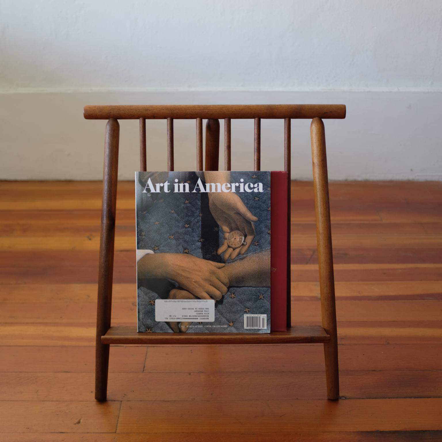 Arthur Umanoff magazine rack for Washington Woodcraft Products. A rarely seen design by the designer. Solid Walnut, 1950s.