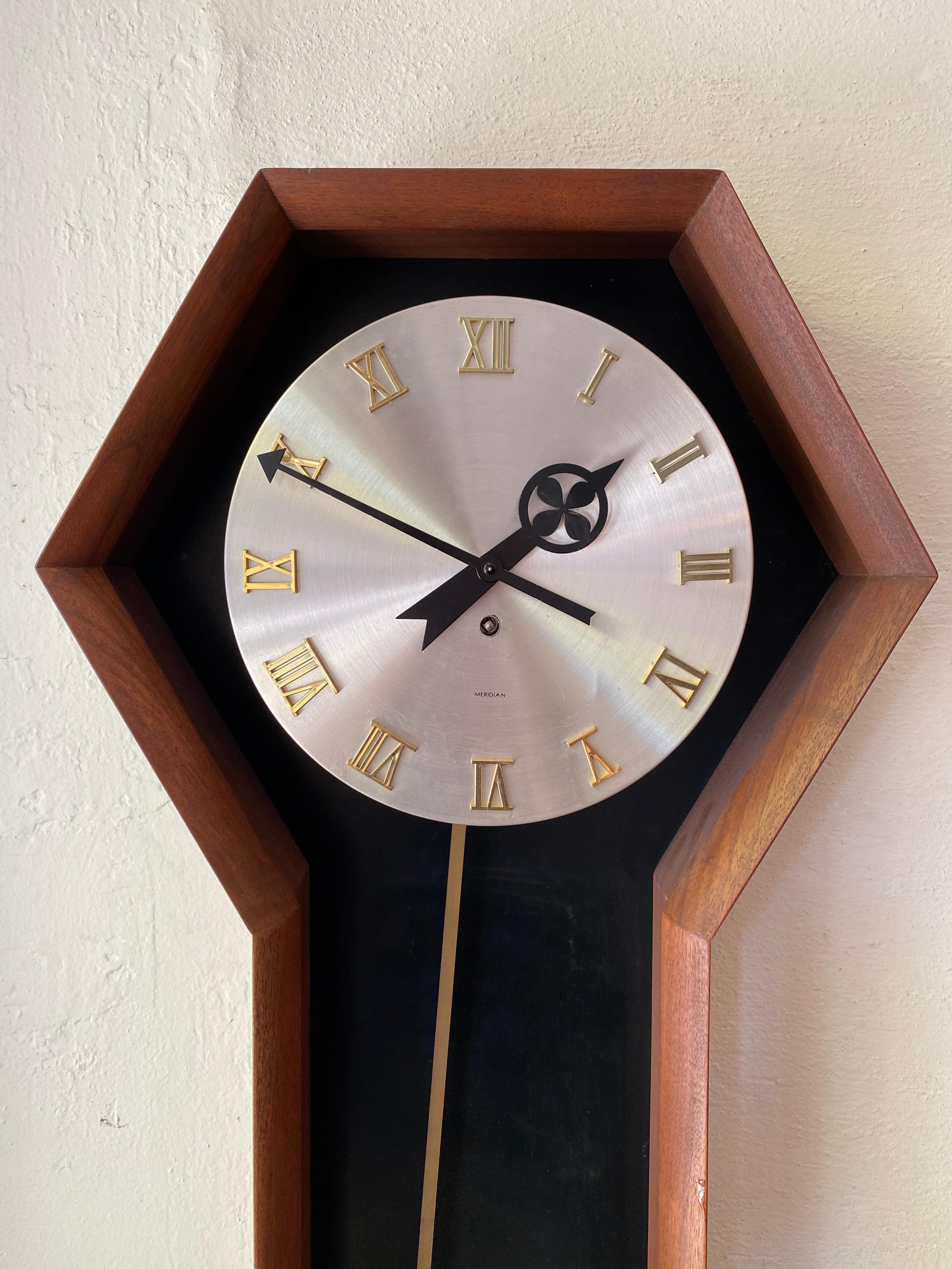 
Arthur Umanoff Meridian/ Howard Miller Wind Up Wall Clock. In good working Condition, currently hanging in the store and keeping perfect time. Includes Key