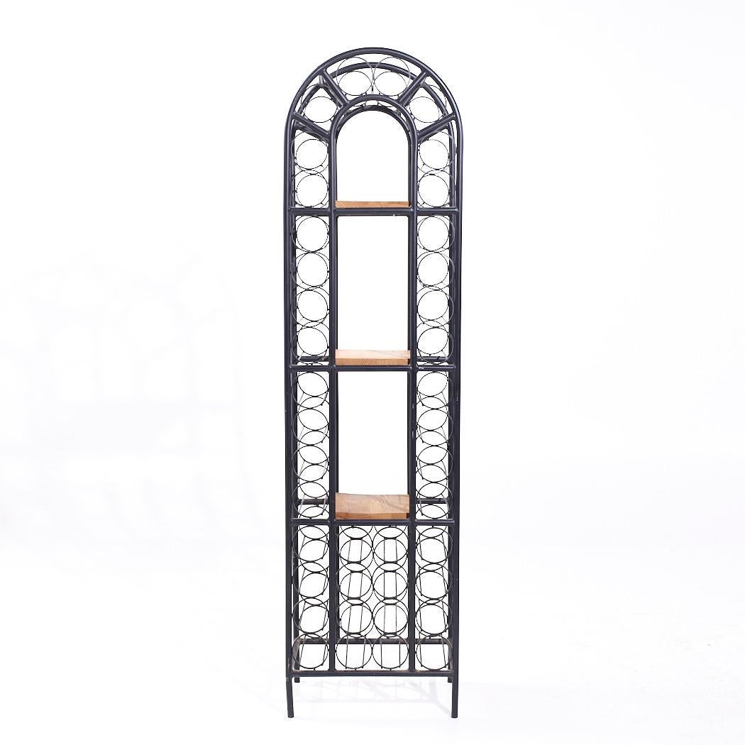 Arthur Umanoff Mid Century 40 Bottle Tall Iron Wine Rack

This wine rack measures: 19 wide x 12 deep x 72 inches high

We take our photos in a controlled lighting studio to show as much detail as possible. We do not Photoshop out
