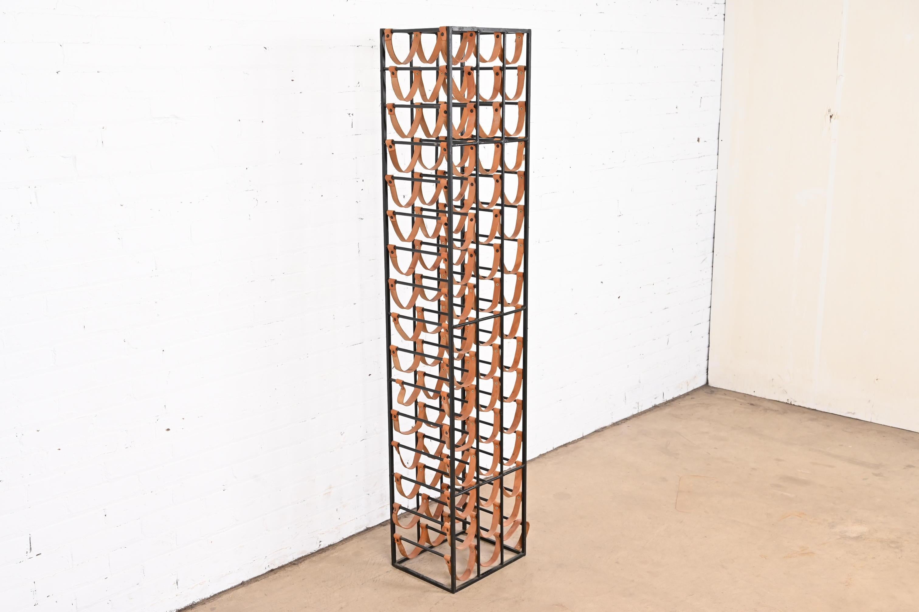 A beautiful Mid-Century Modern 48-bottle wine rack

By Arthur Umanoff for Shaver Howard.

USA, 1950s

Wrought iron frame, with leather straps.

Measures: 14