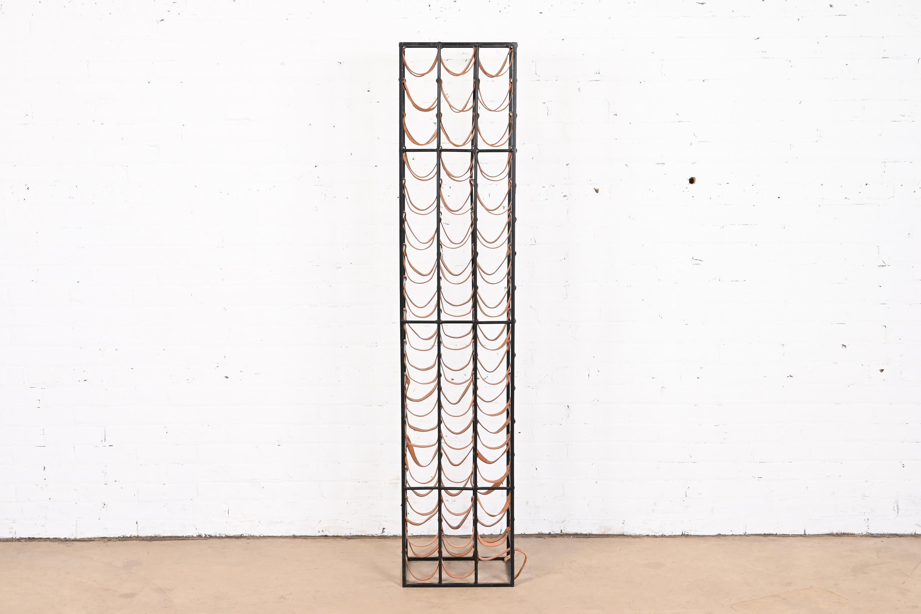 Arthur Umanoff Mid-Century Modern Wrought Iron and Leather 48-Bottle Wine Rack In Good Condition In South Bend, IN