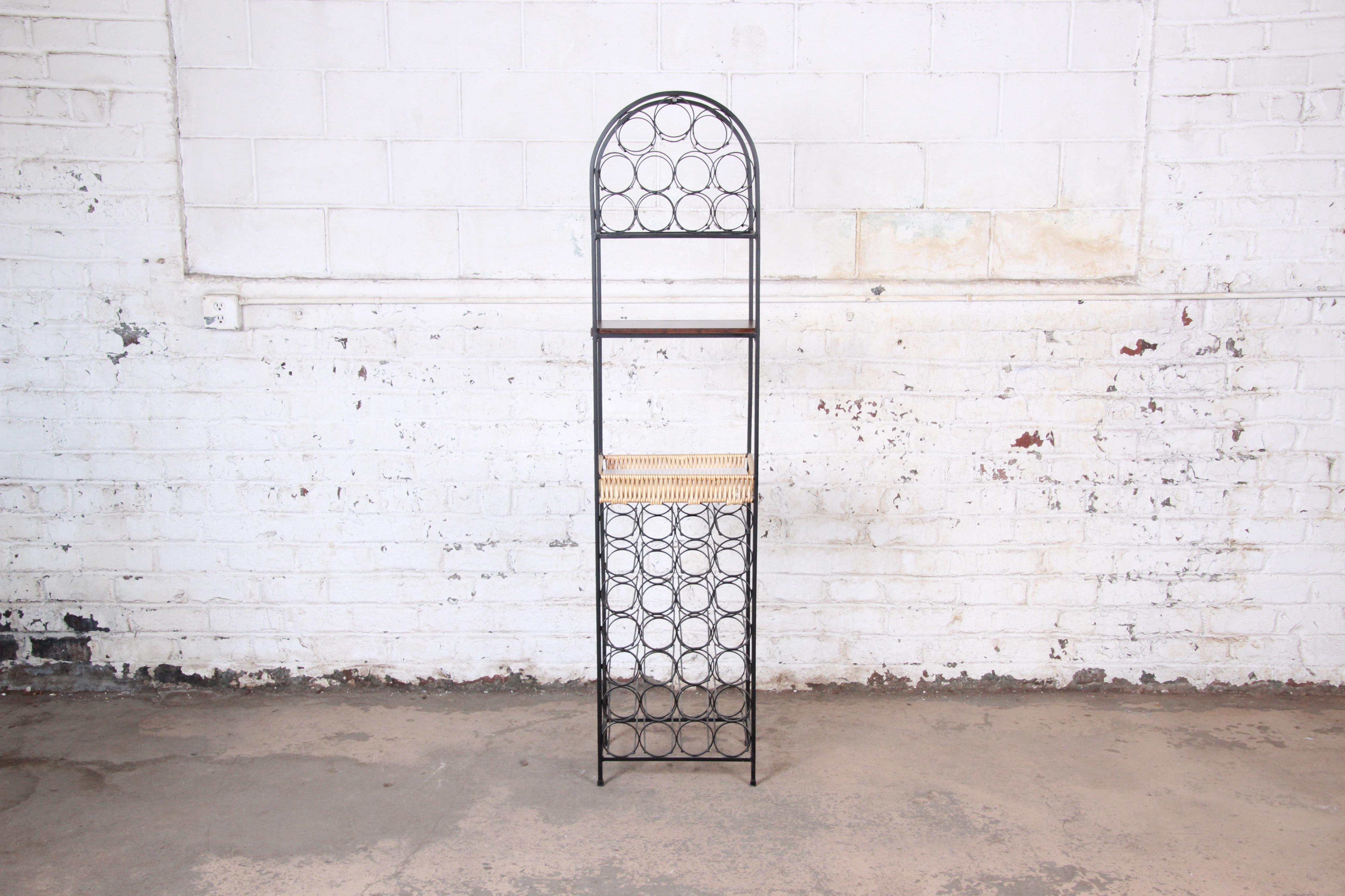 An exceptional Mid-Century Modern wrought iron arched wine rack

By Arthur Umanoff for Shaver Howard

USA, circa 1950s

Wrought iron, wicker and laminate

Measures: 16.75