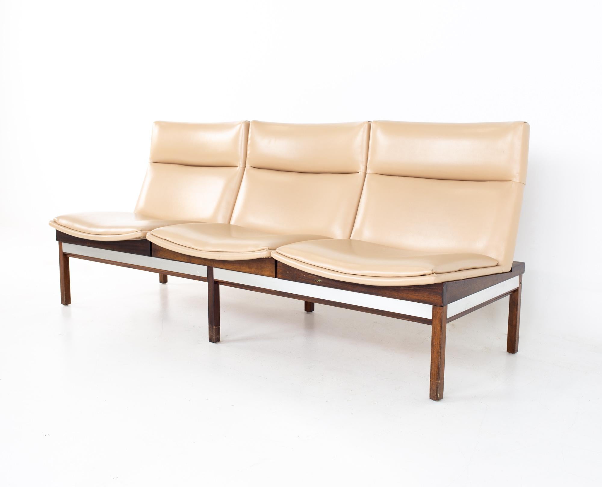 Arthur Umanoff mid century walnut and stainless three seat sofa bench
Sofa measures: 71 wide x 26 deep x 32 high, with a seat height of 16 inches

All pieces of furniture can be had in what we call restored vintage condition. That means the piece