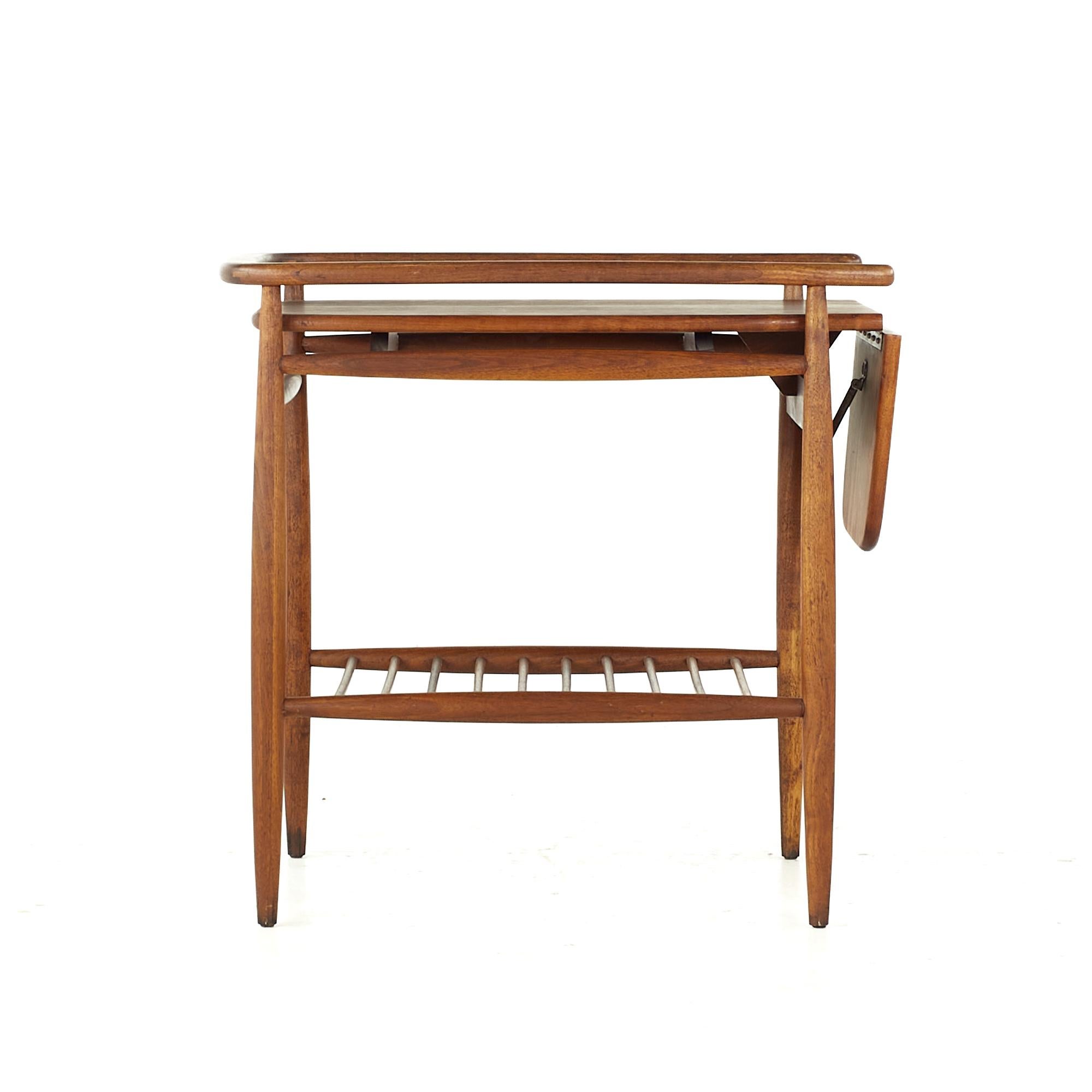 Arthur Umanoff midcentury Walnut Bar Cart

This bar cart measures: 20.75 wide x 30 deep x 28.75 inches high
Extended the depth measures 38.75 inches

All pieces of furniture can be had in what we call restored vintage condition. That means the