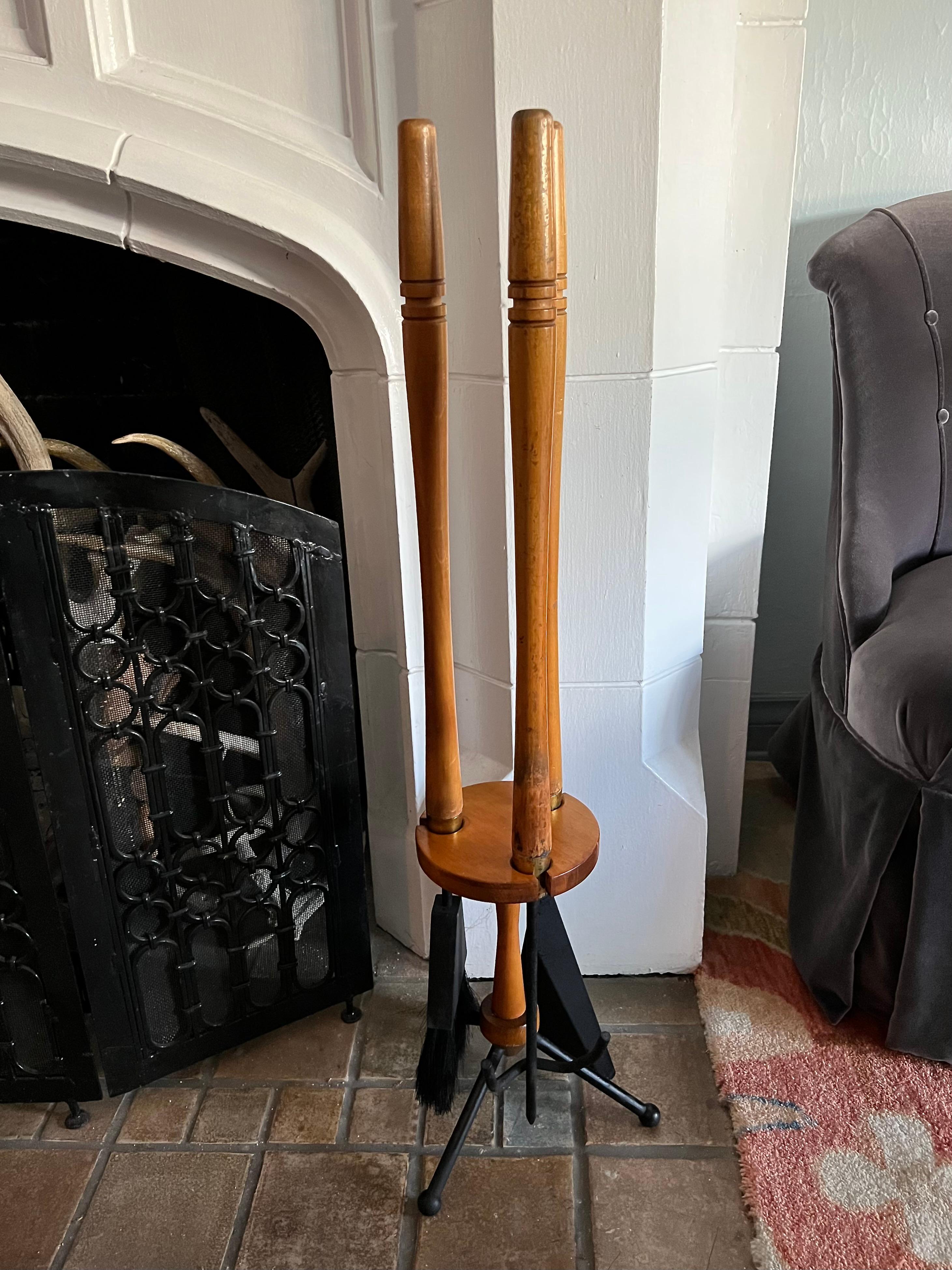 Gorgeous midcentury sculptural fireplace tool set with warm patinated maple wood, brass, and clean black accents. A complement to any fireplace, perfect for cozy warm minimalist homes. Designed by Mid Century designer, Arthur Umanoff, in his