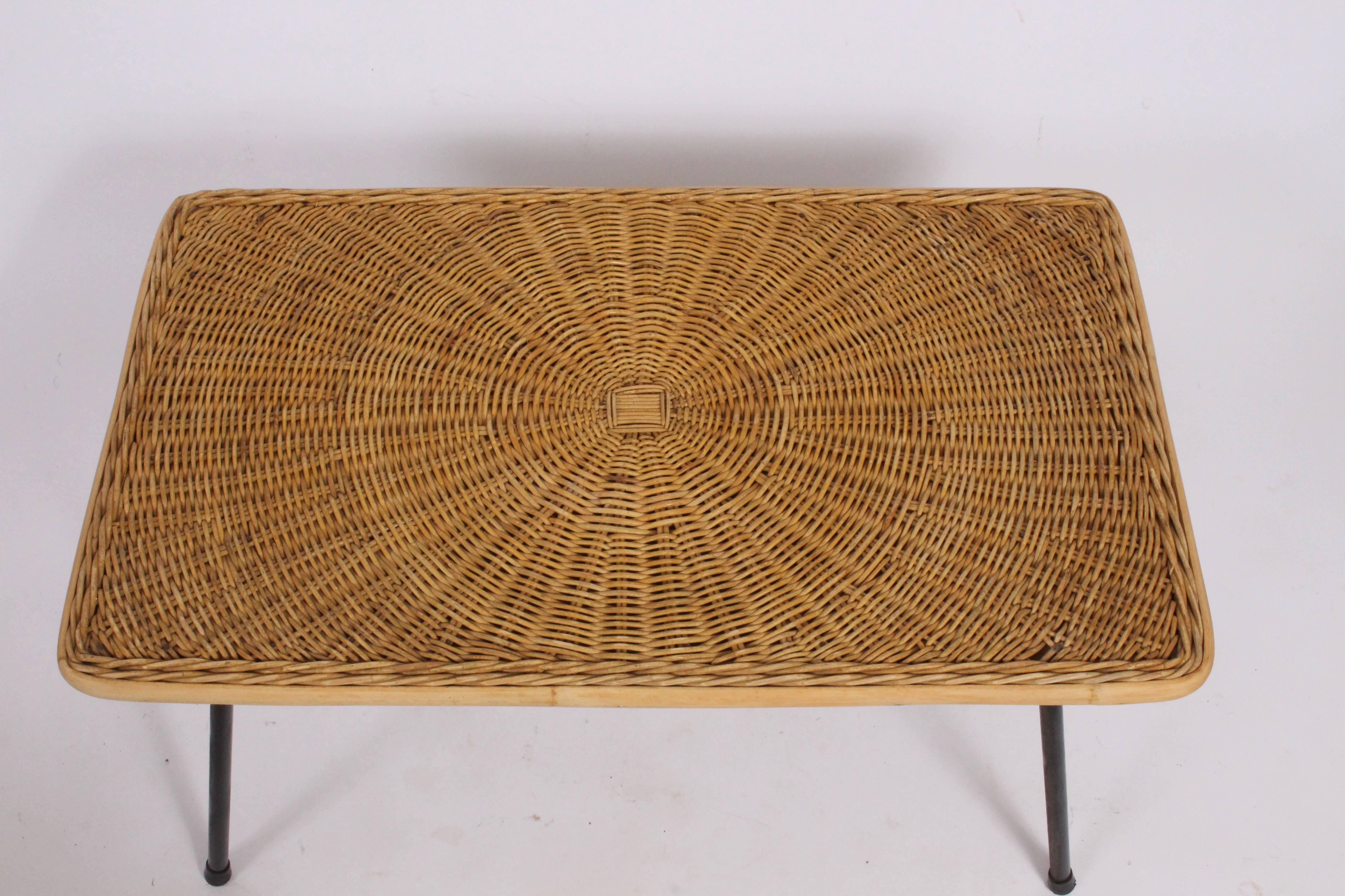 Arthur Umanoff for Raymor black wrought iron and woven wicker occasional table, 1950s. Rectangular woven wrapped surface with capped wrought iron legs. Classic Versatile. Fine design.  Available for professionally packaged parcel delivery, please