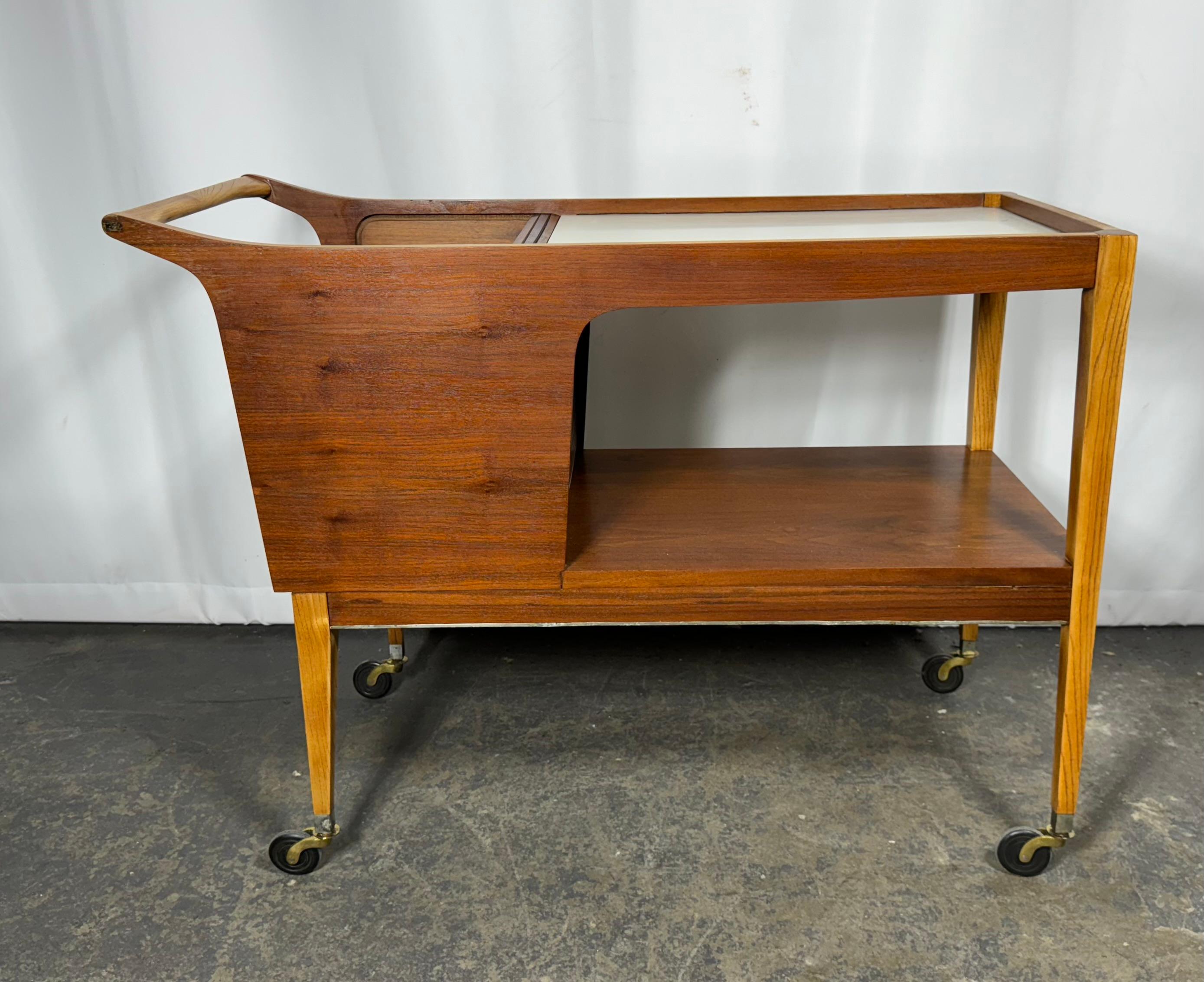 Arthur Umanoff for Cavalier Dimension Group Rolling Server Bar Cart Walnut. Super Rare !  I really despise using that word because it is so over-used. But, in this case I cannot think of a better adjective for this fabulous Mid-Century Modern server
