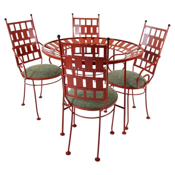 Arthur Umanoff round wrought iron table with four chairs in terra cotta