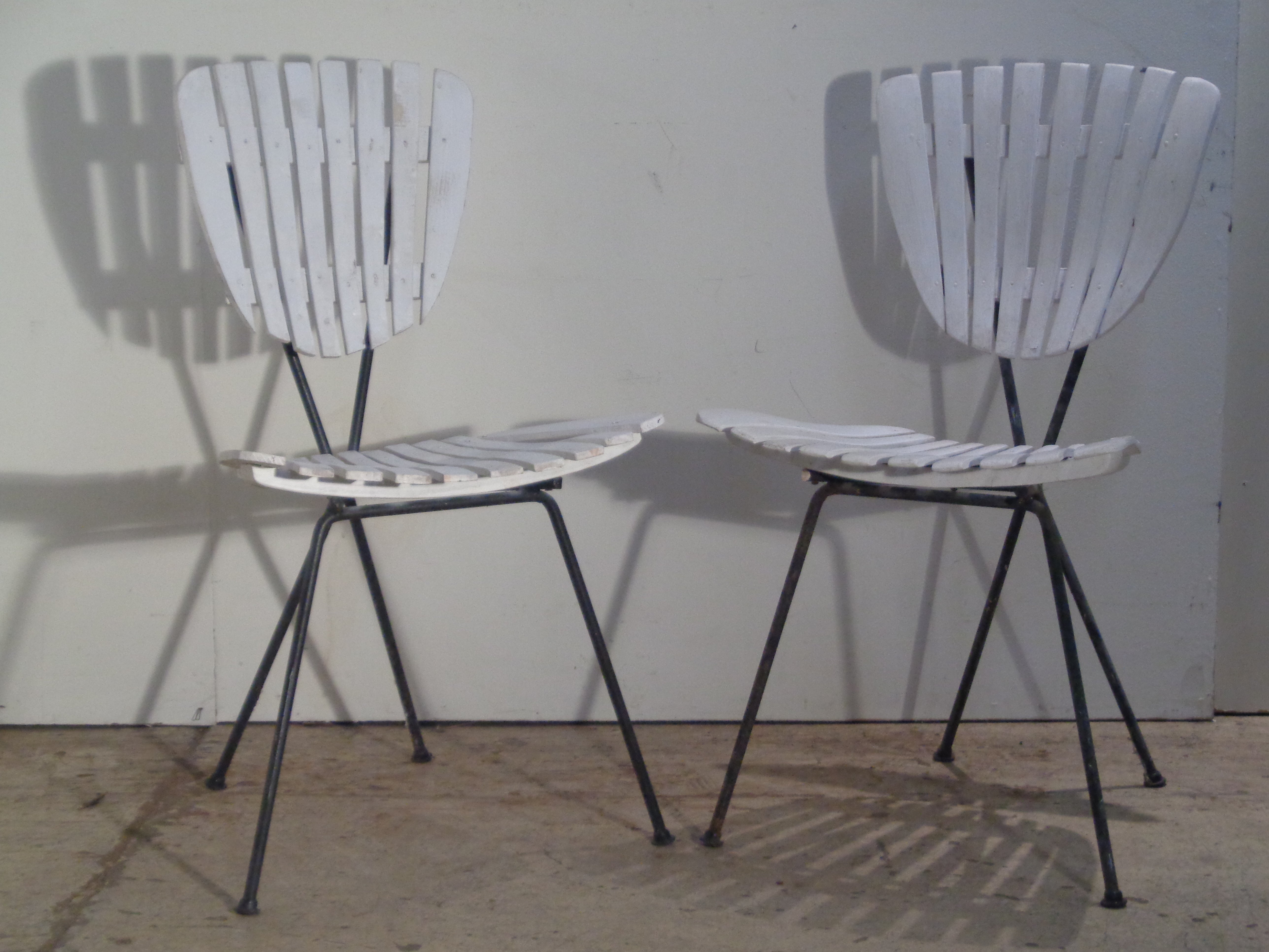 Blackened iron frame wood slat chairs with great sculptural form - designed by Arthur Umanoff. Circa 1960. Look at all pictures and read condition report in comment section. 
 