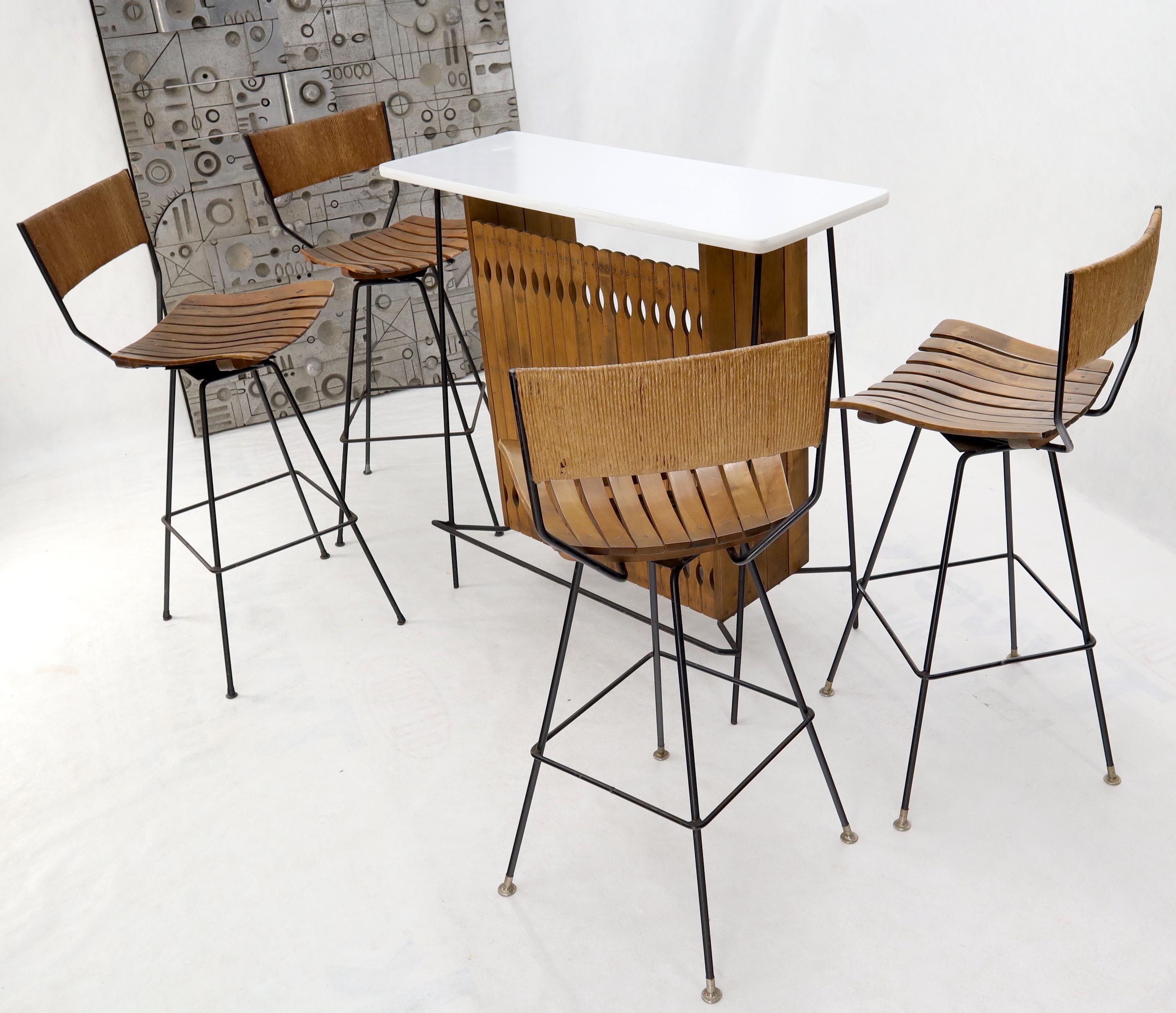 Mid-Century Modern Arthur Umanoff wrought iron and rattan bar and bar stools.