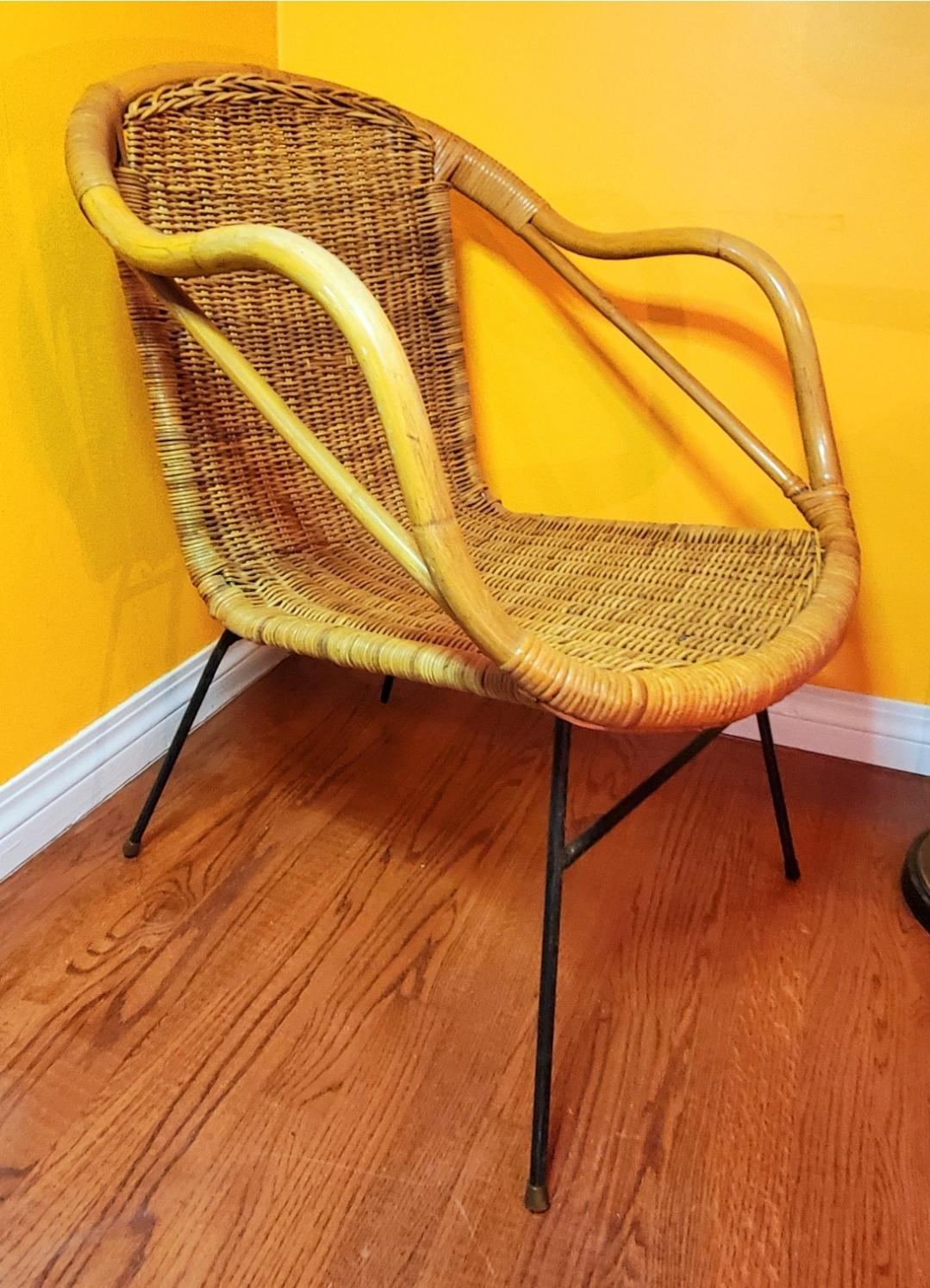 Got conflicting information on this one.
1950s Danish or Arthur Umanoff (style?)
Either way, it's a badass accent chair.
Wicker basket seat with rattan arms and supports.
Minor areas with broken wicker (pictured)
Doesn't affect functionality. 