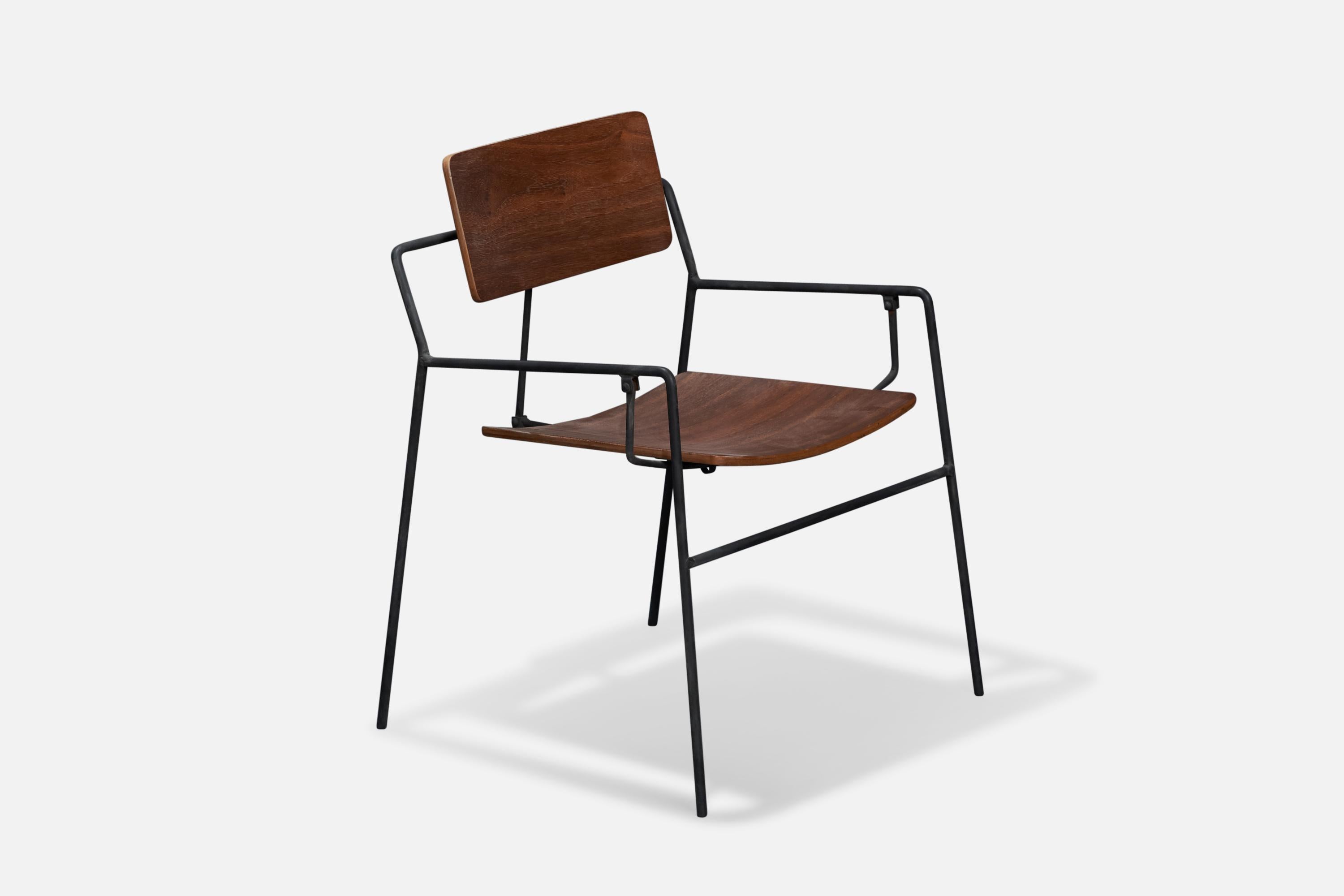 A swinging black-painted iron and walnut side chair designed by Arthur Umanoff in 1953 and produced by The Elton Company, USA, 1950s.

Seat height: 15.75