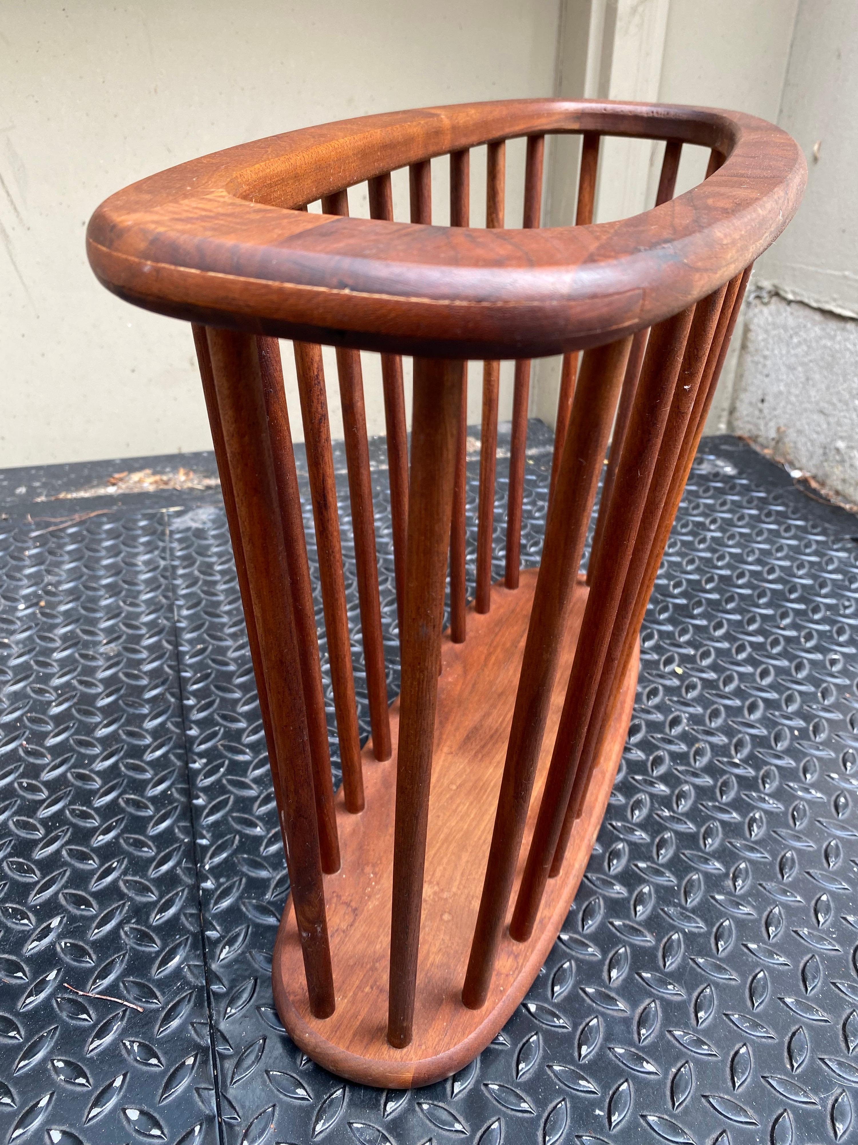 Arthur Umanoff walnut magazine rack or holder. Made up of dowels with a oval open top and solid bottom.