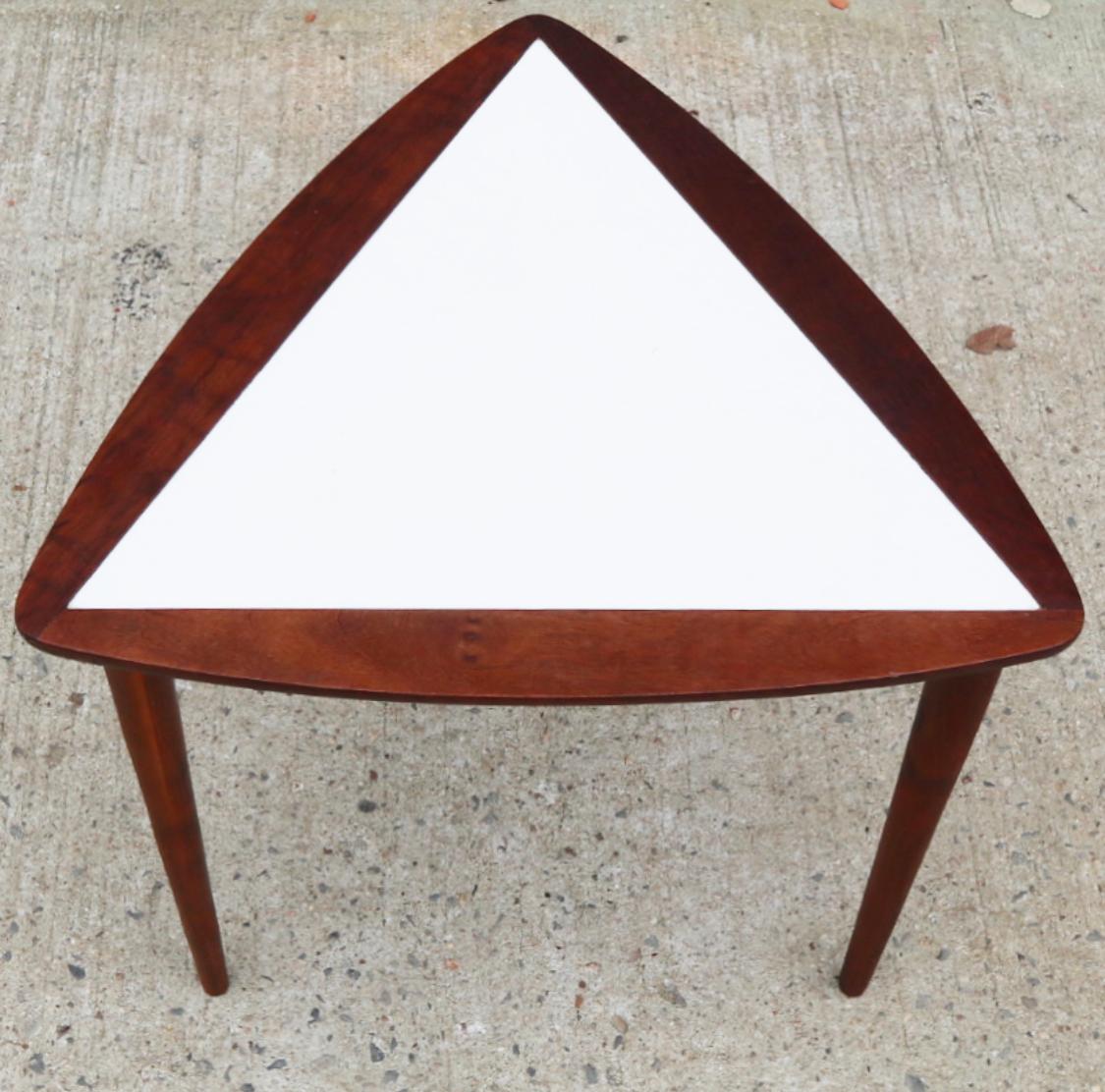 Gorgeous walnut triangular side table designed by Arthur Umanoff. Deep walnut wood finish with rich patina.