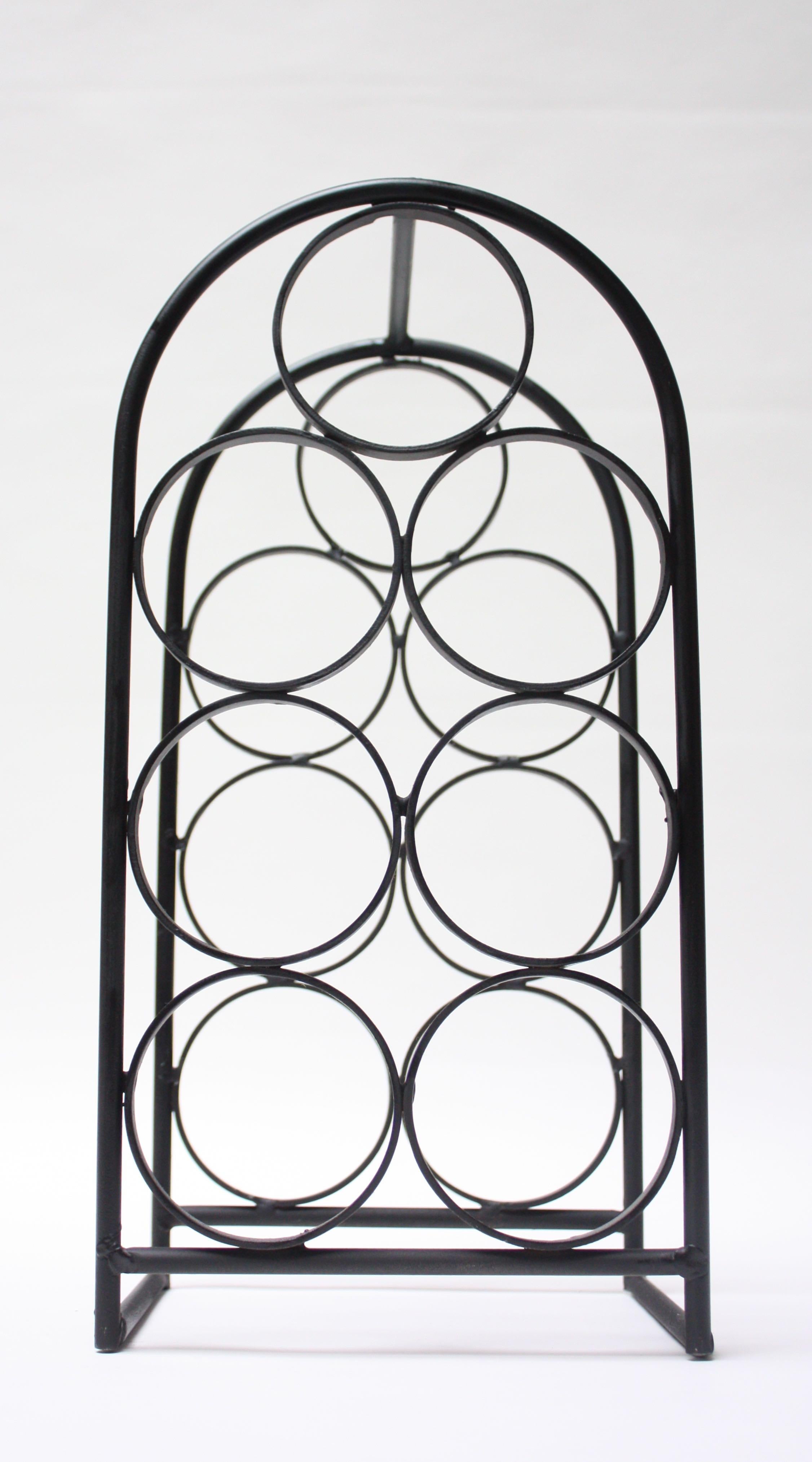 1950s Arthur Umanoff wine rack composed of painted wrought iron construction. Tabletop version, accommodating 7 bottles.