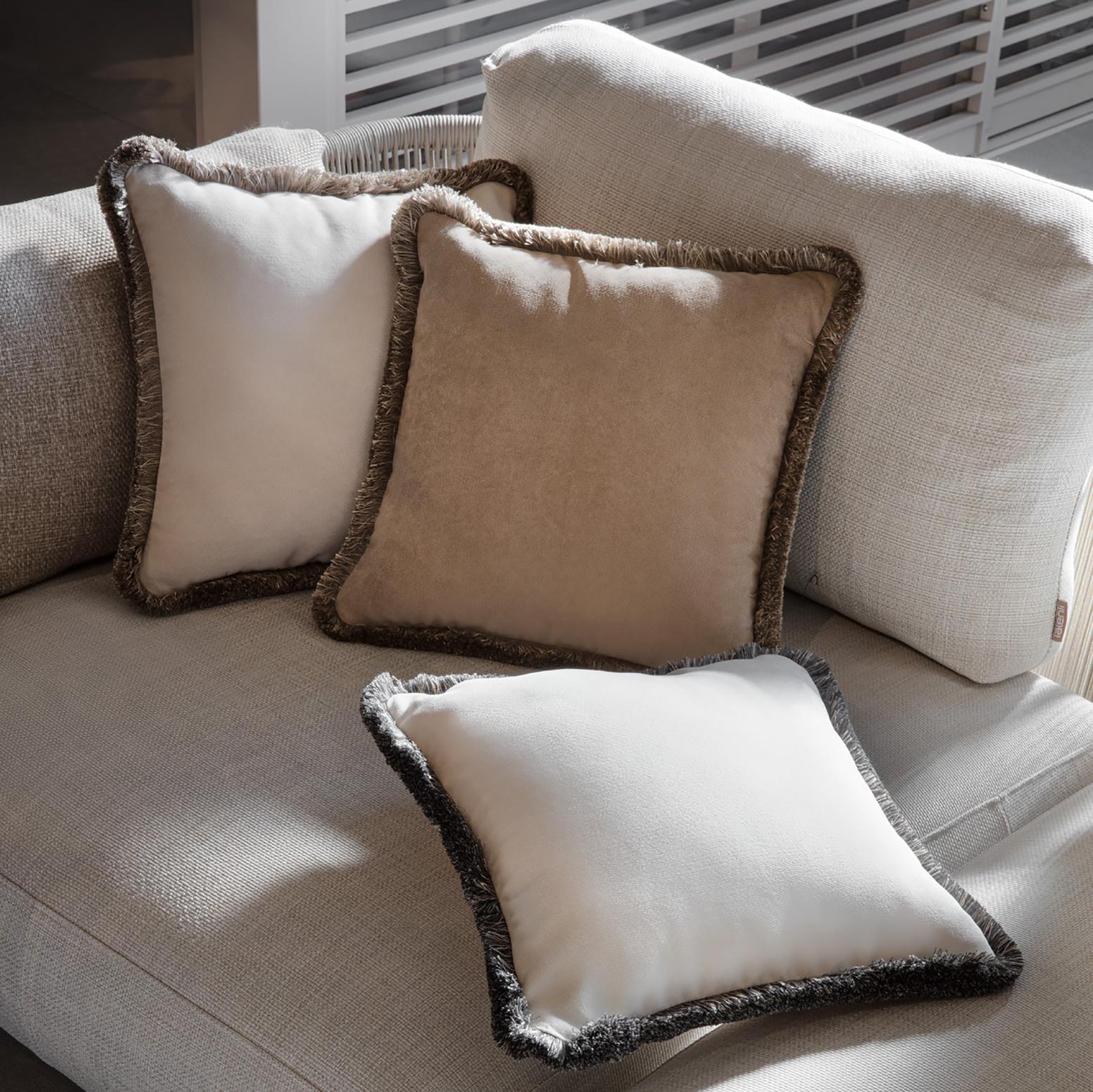 This elegant cushion cover was carefully hand-sewn with soft, beige velvet and contoured by prestigious multicolor cotton fringes. A sophisticated addition to a classic or contemporary sofa alike, it can be paired with a twin for a coordinated