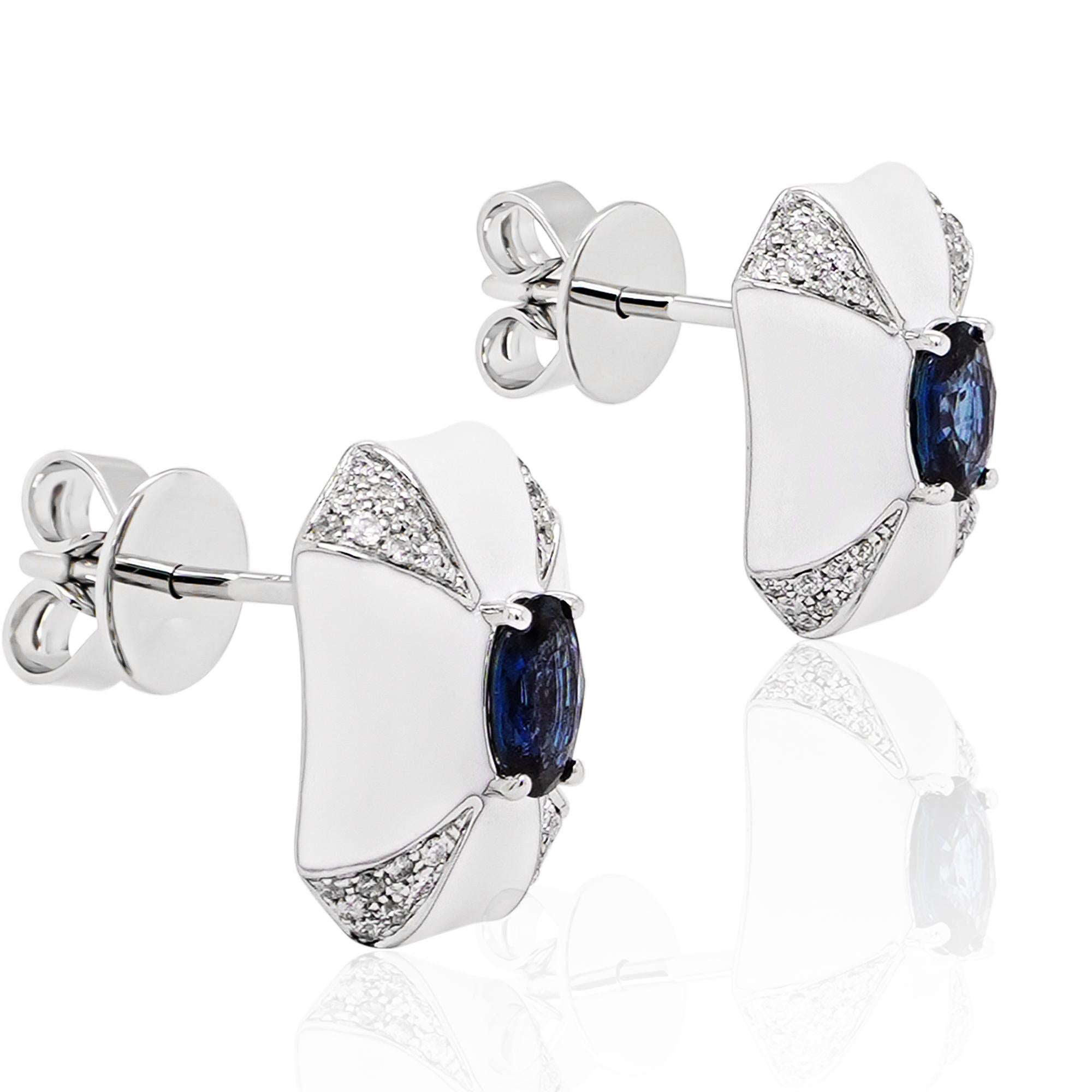 0.67 carat vivid blue sapphire are set with 0.17 carat of white round brilliant diamond set in 18K gold. The earring has been made with artic ice enamel which gives it a very edgy feel. The details of the diamond are mentioned below:

Color: