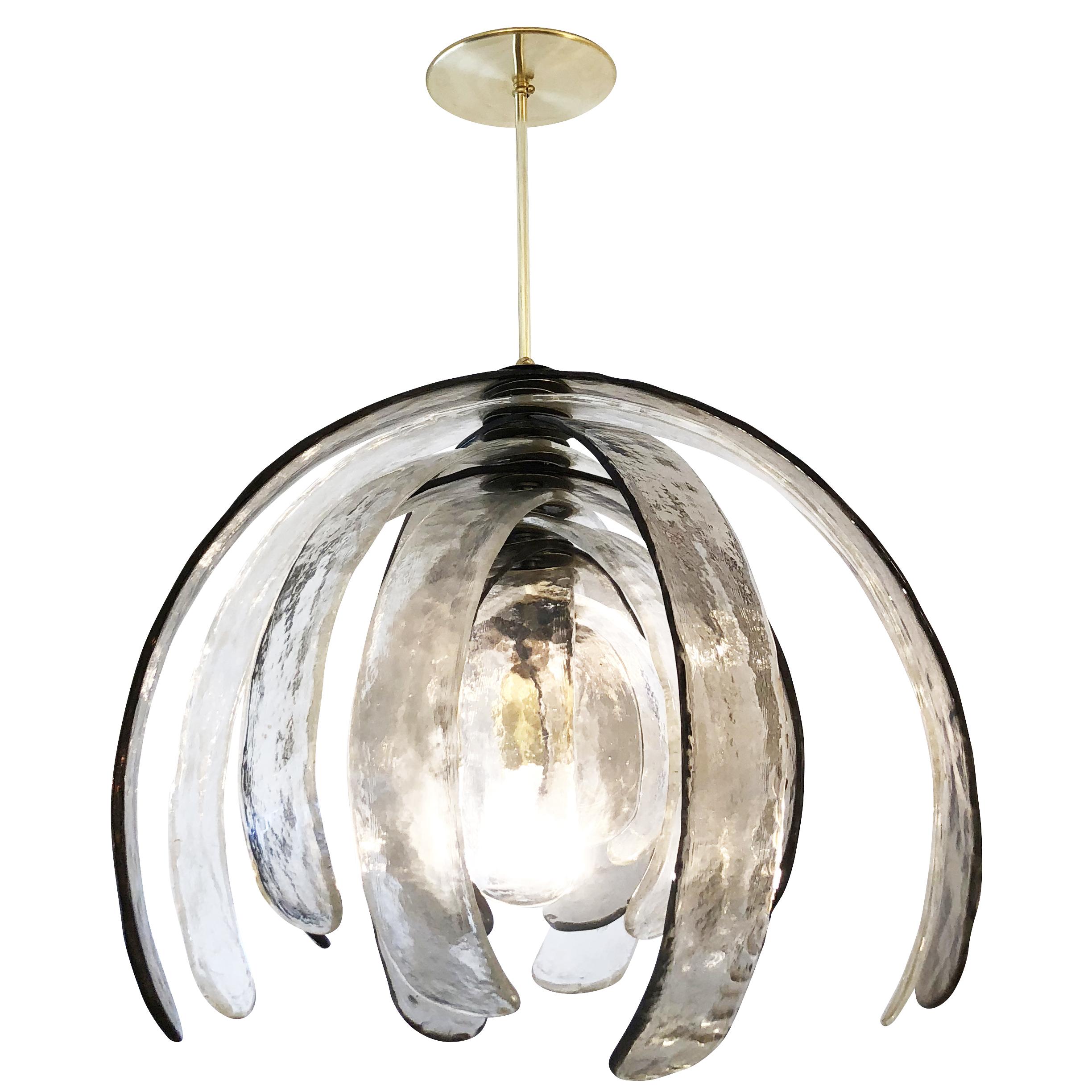 Sculptural Murano glass chandelier designed by Carlo Nason for Mazzega in the 1960s. It’s composed of several alternating clear and gray textured petal shaped glasses that can rotate around the center stem. Holds one regular socket. Stem can be