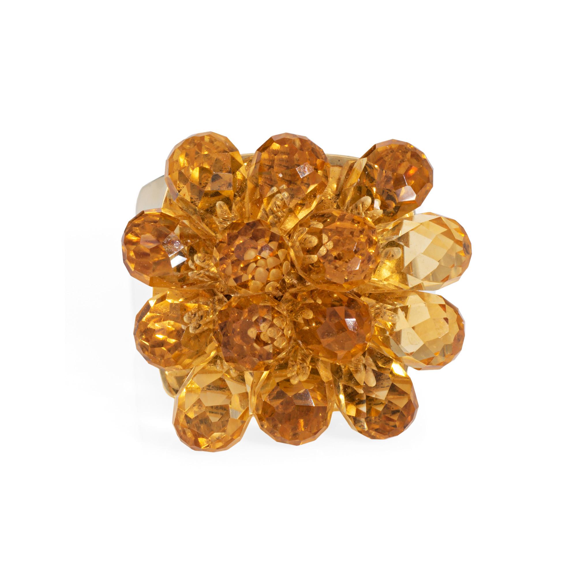 Stylish contemporary citrine ring crafted in 14 karat yellow gold. 

Briolette cut citrines measure 5mm. The citrines are in very good condition and free of cracks or chips.    

Golden hued citrines adorn the mount, with each to set to allow for a