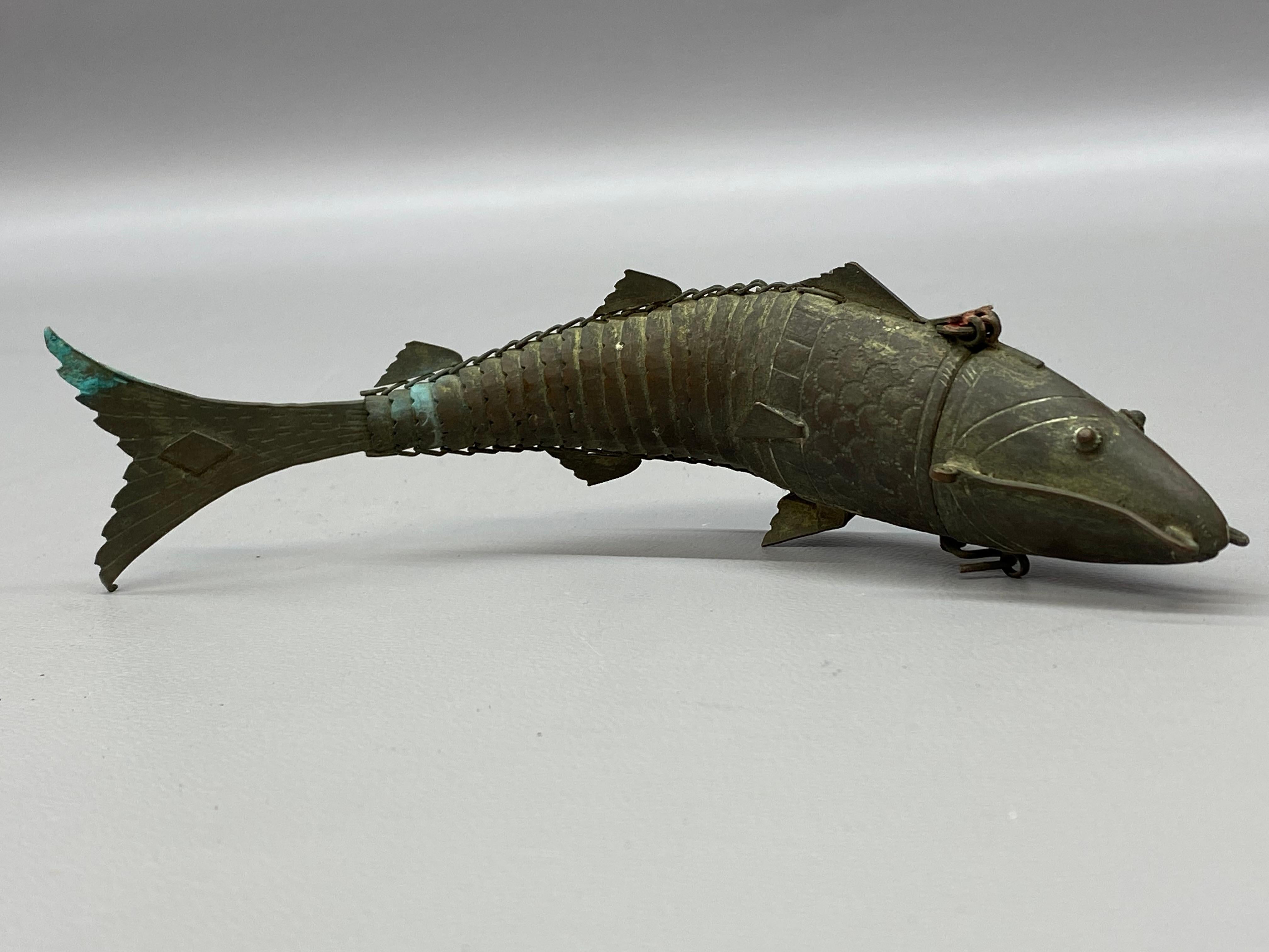 Gold wash over copper articulated fish known as a Besamin spice box often used in the Havdalah ceremony at the end of the Sabbath. Havdalah is preformed on a Saturday evening. the burning of spices symbolized the sweetness of Shabbat. The head opens