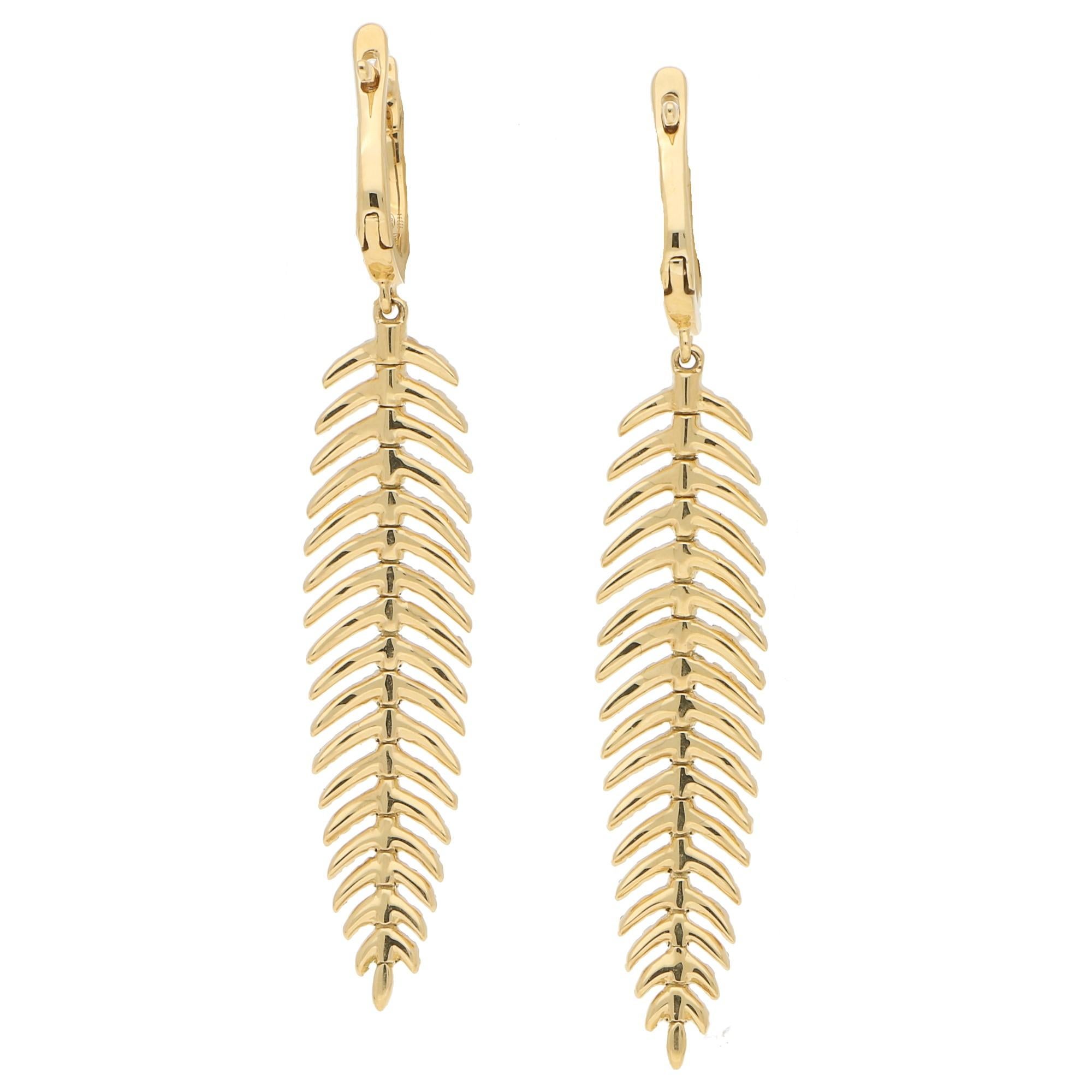 gold feather drop earrings