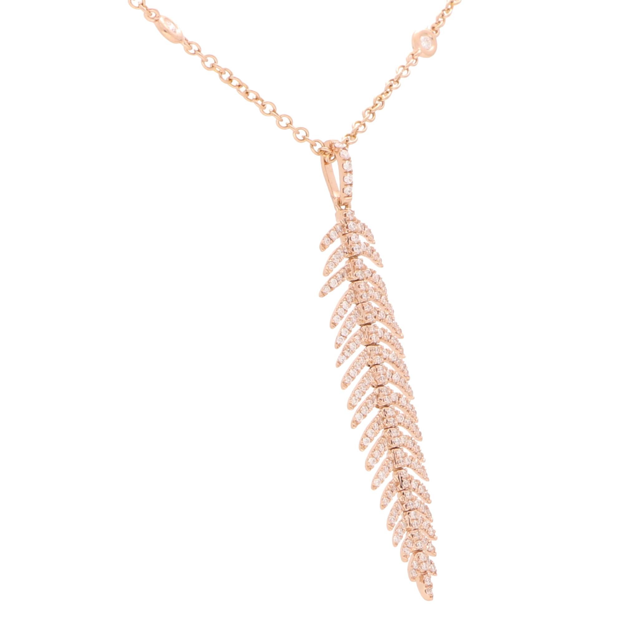 An extremely elegant articulated feather pendant on a diamond spectacle chain set in 18k rose gold.

The central pendant depicts a beautiful sparkly feather which is articulated and claw-set throughout with round brilliant-cut diamonds. Each feather