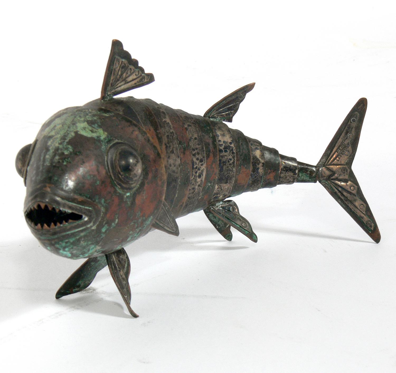 Articulated fish sculpture by Graziella Laffi, Peru, circa 1950s. Impressed signature on tail, see last detail photo. Executed in hand-hammered copper and sterling silver. Wonderful original verdigris patina.