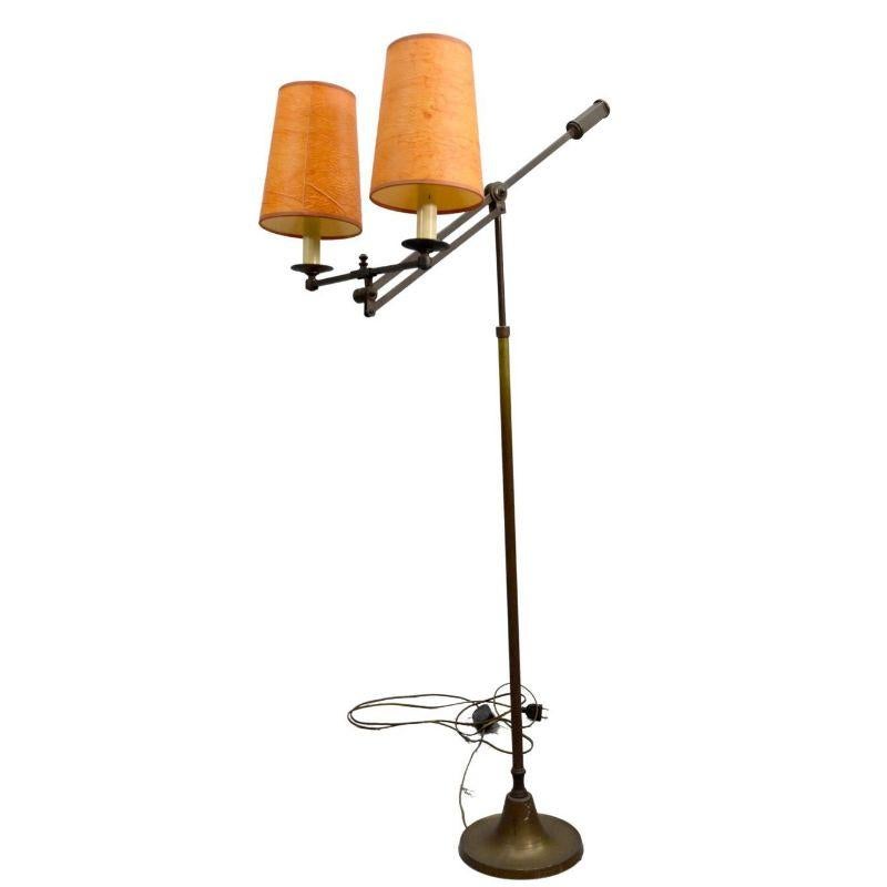 1940 Articulated floor lamp in brass with 2 lights with orange shades, height 153 cm for a width of 41 cm and a depth of 20 cm.

Additional information: 
Style: 1940s to 1960s.
