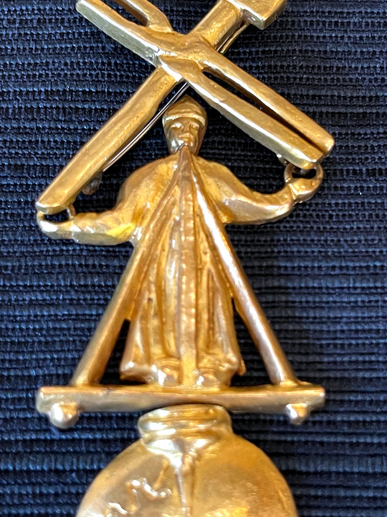 Articulated Gilt Bronze Brooch Le Travail Dominant Le Mond by Line Vautrin In Good Condition For Sale In Atlanta, GA