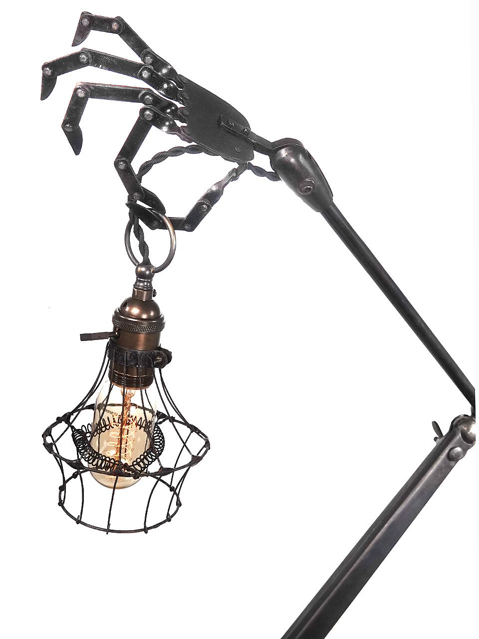 These amazing desk lamps will become the focal point of any room it's placed in. It's a bit Steampunk, Adams family and the nightmare before Xmas rolled into one. All the joints including four on each brass finger are articulated and can be posed